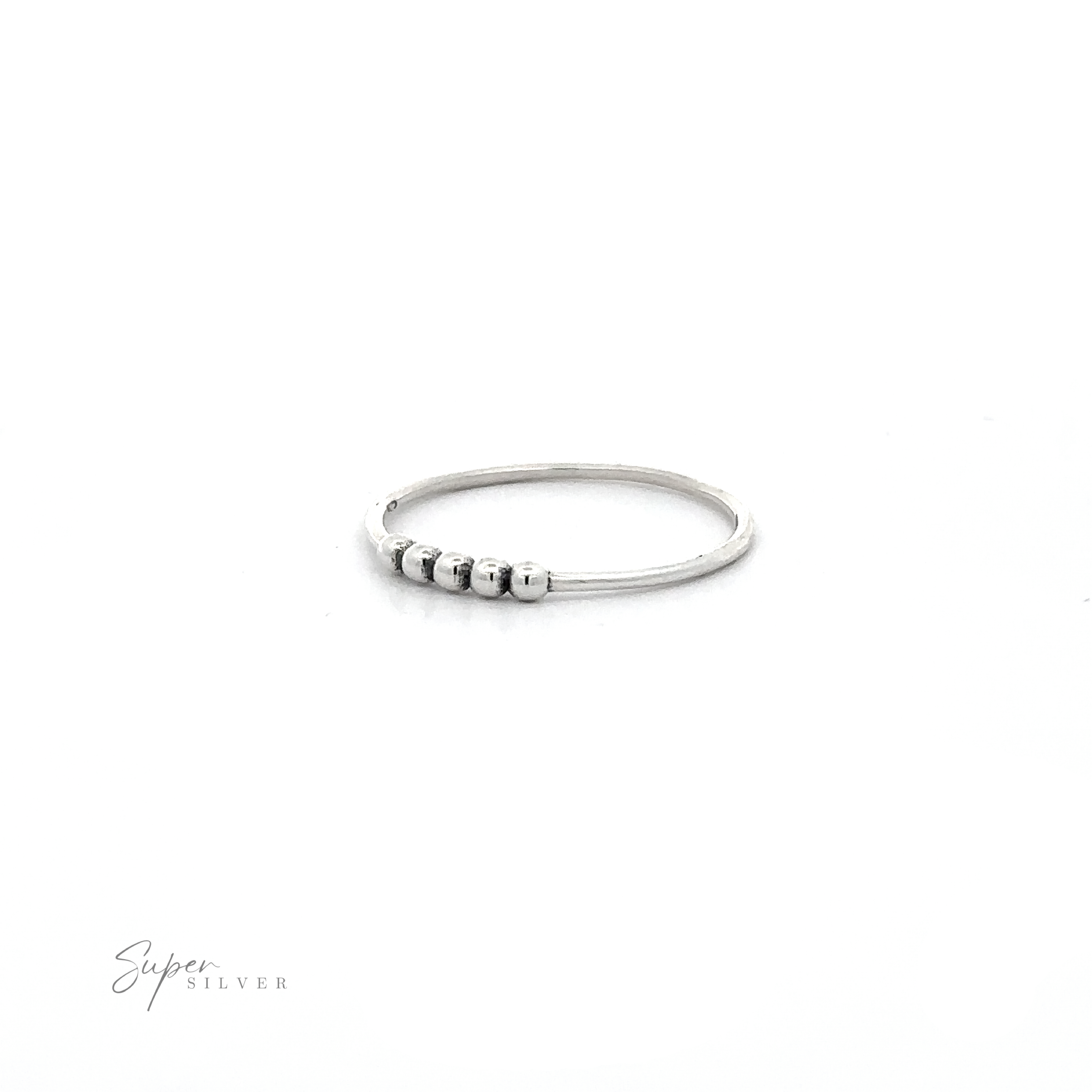 A Silver Ring With Beads with three small beads on it.