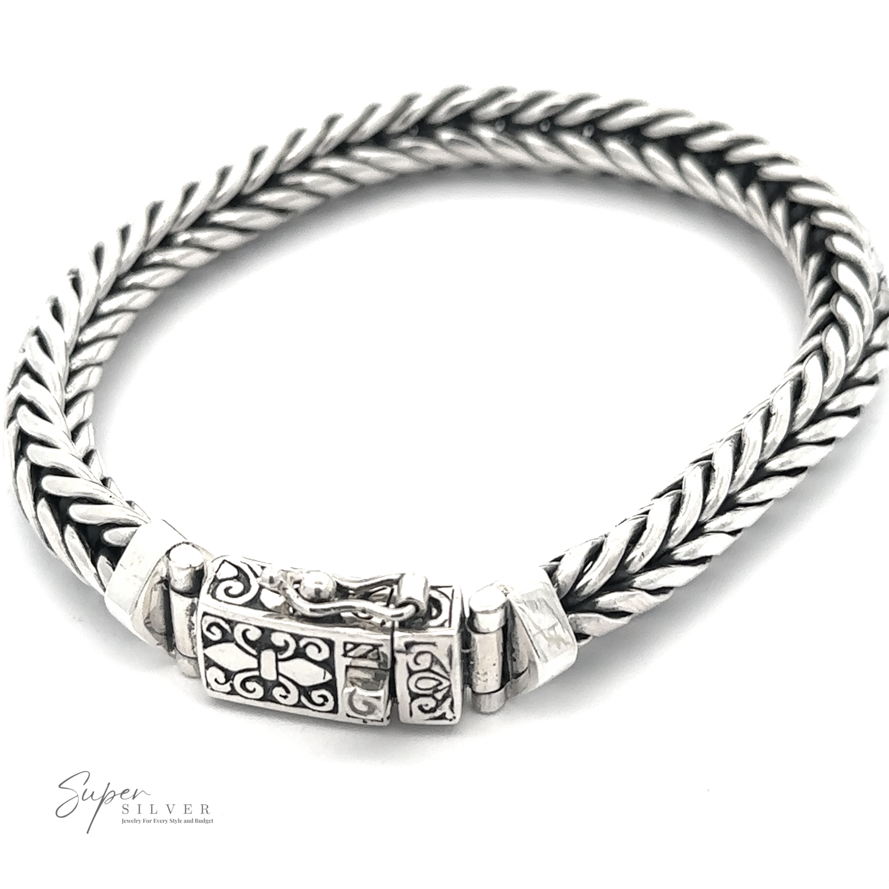 A Heavy Braided Bracelet with an ornate clasp, displayed on a white background. The logo "Super Silver" is visible in the bottom left corner.