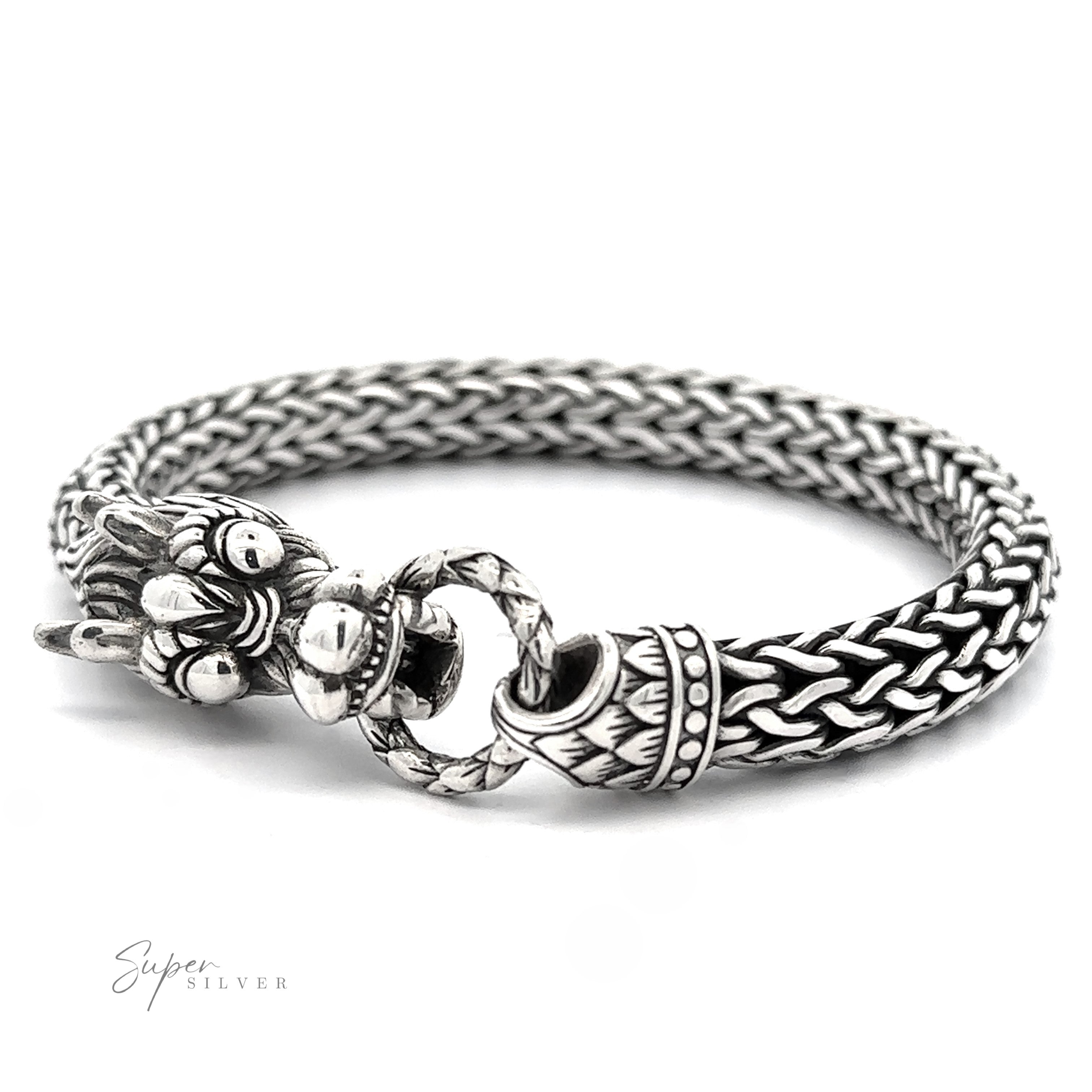 A Sterling Silver Braided Rope Bracelet with Dragon Head featuring a detailed clasp holding a ring, crafted from thick braided rope and .925 Sterling Silver, with "Super Silver" text in the bottom left corner.