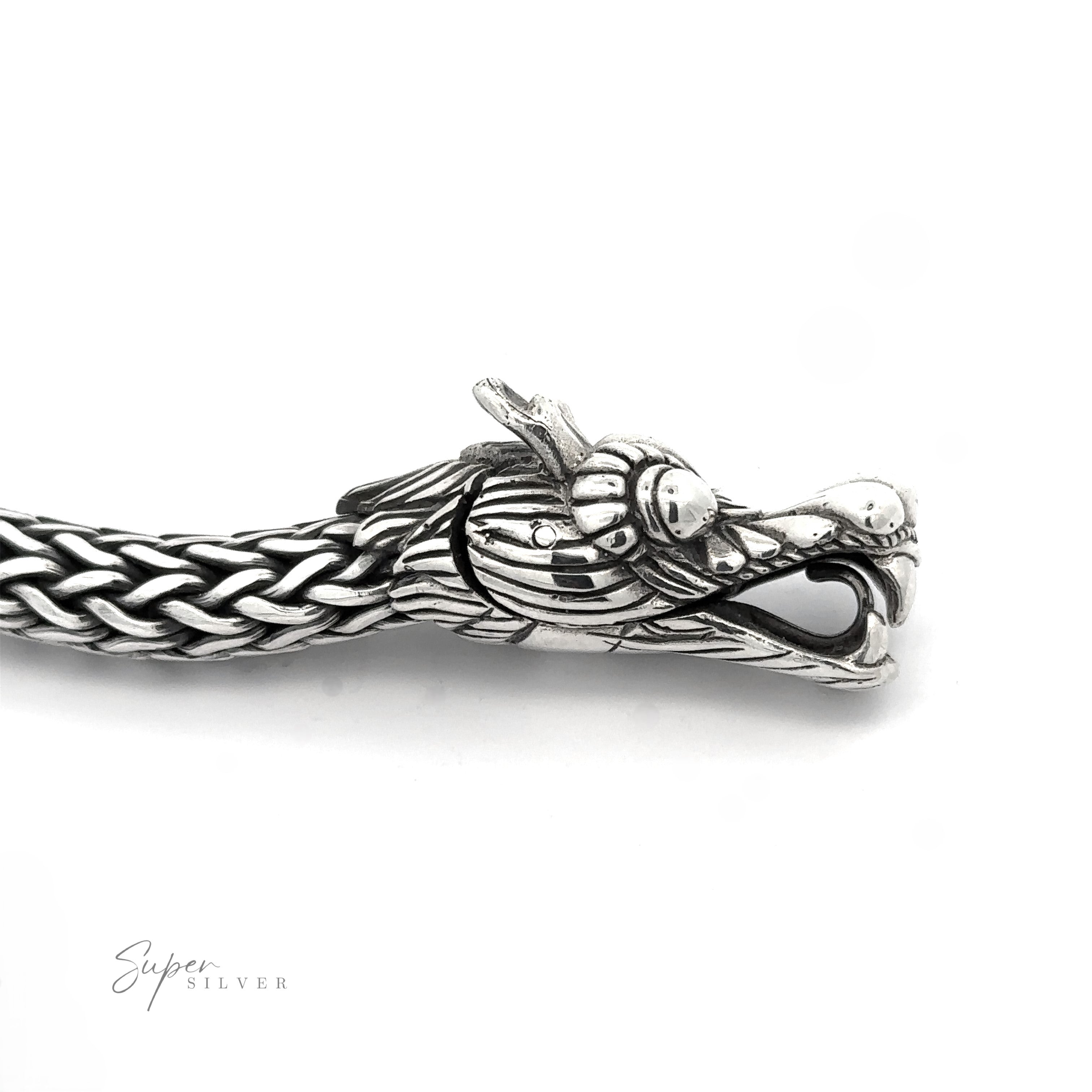 A detailed Sterling Silver Braided Rope Bracelet with Dragon Head featuring an intricately designed, heavy-duty dragon head on one end. The bracelet has a thick braided rope pattern and a polished finish.