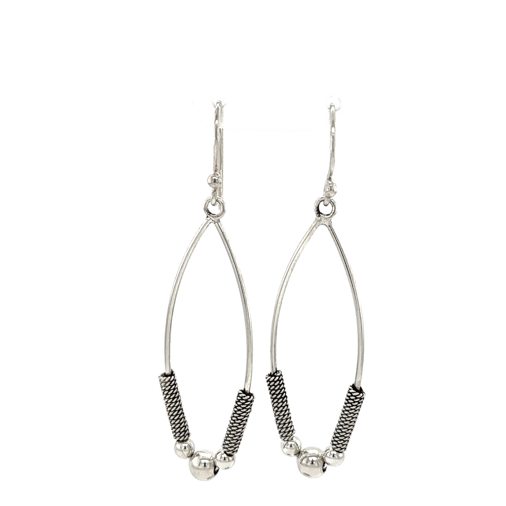 A pair of Super Silver Bali Style Marquise Drop Earrings with black beads.