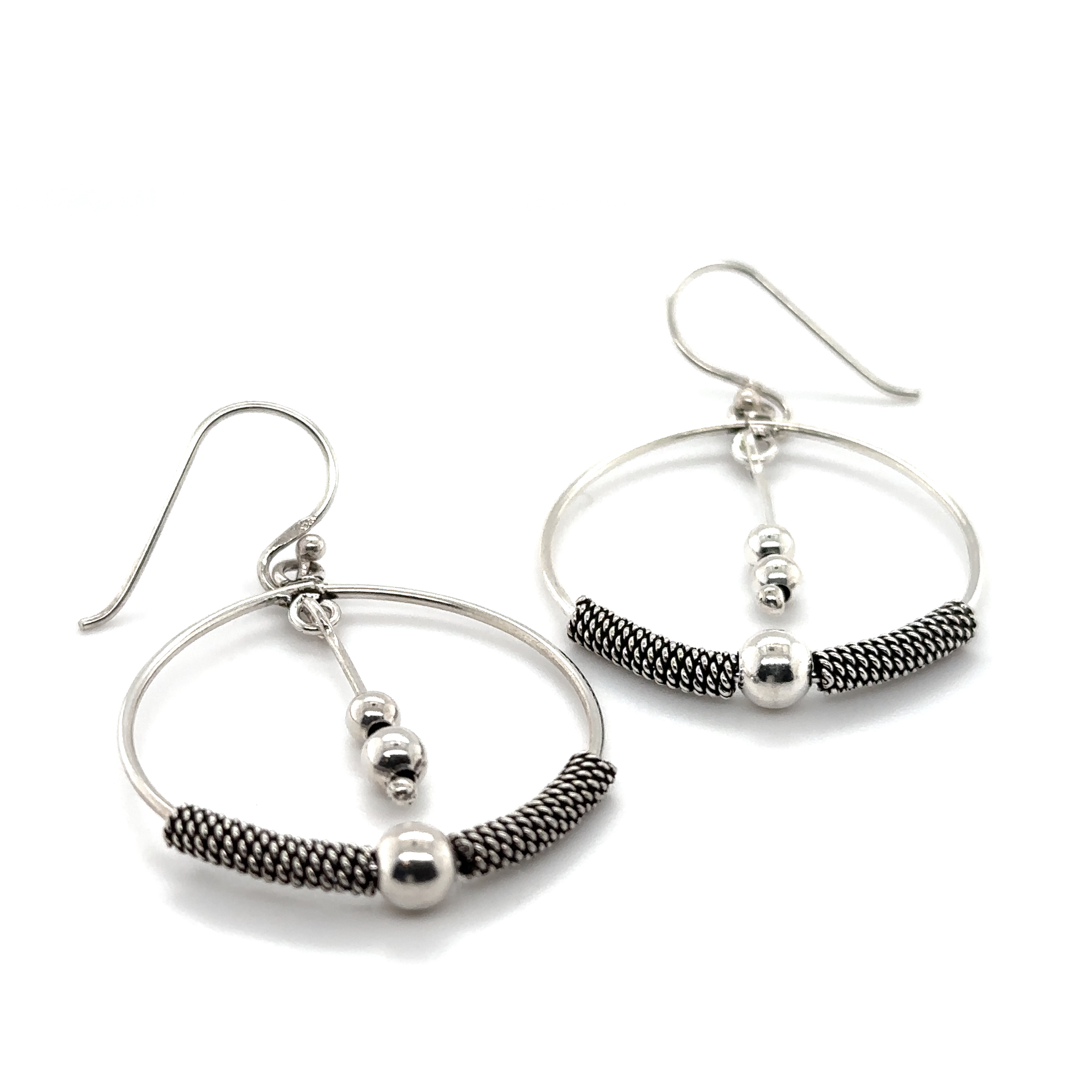 Handcrafted Super Silver Bali Style Circle Drop Earrings with Tassel accented by black beads.
