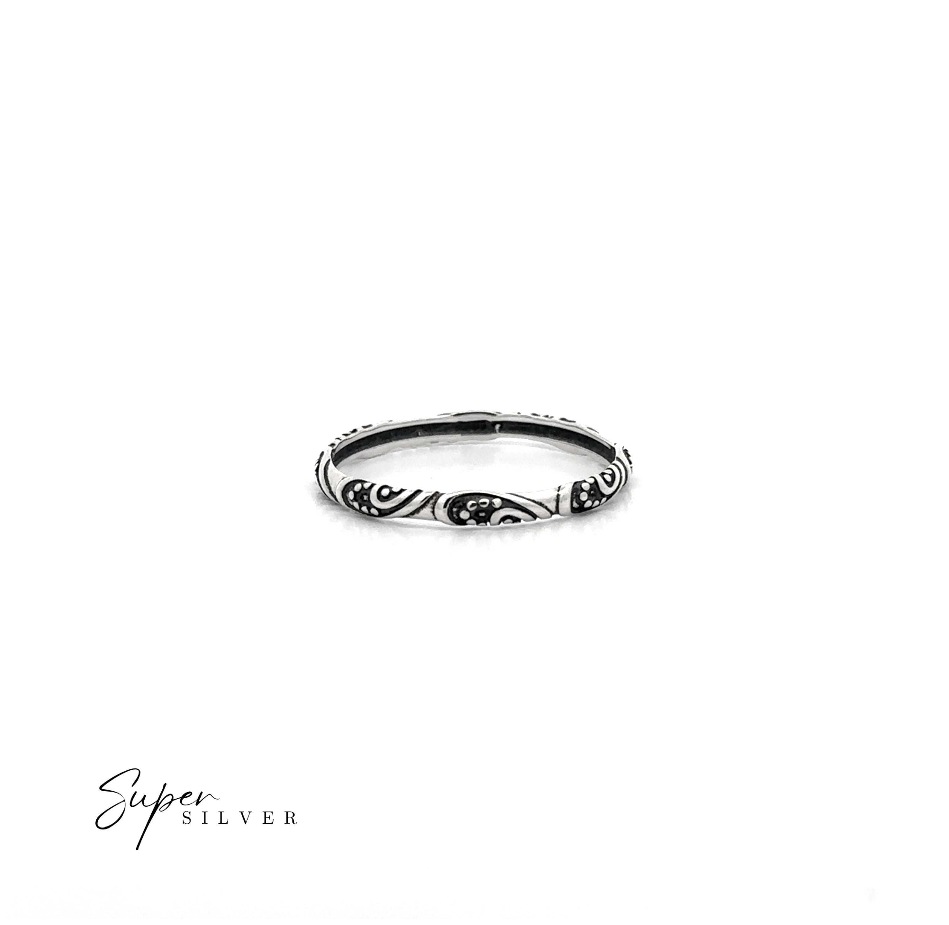 Delicate Bali Style Band: Thin sterling silver ring with engraved floral and swirl patterns, shown on a white background. Ideal for a boho look. "Super Silver" logo featured in the bottom left corner.