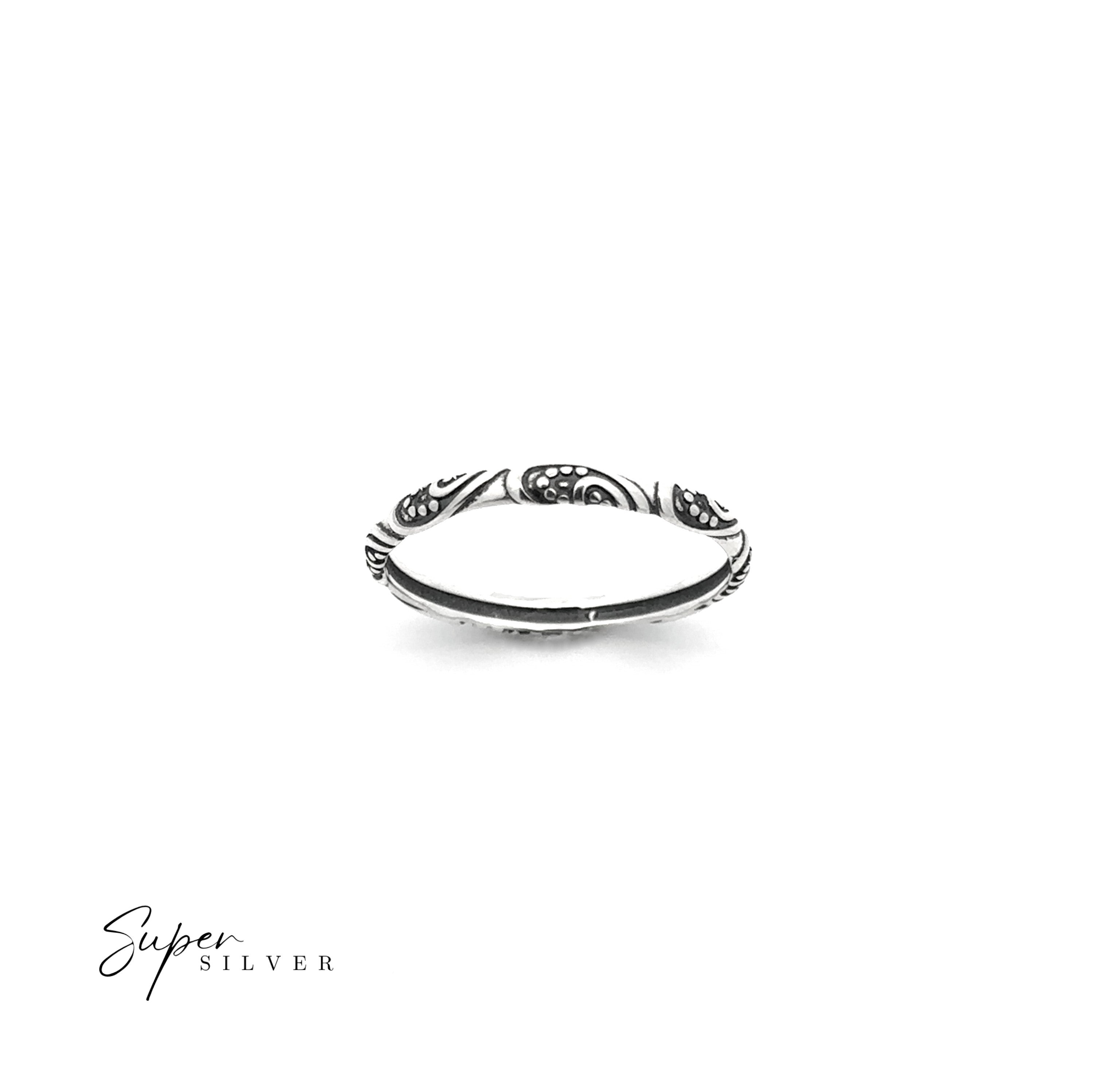 A Delicate Bali Style Band in sterling silver with an intricate engraved pattern is displayed on a plain white background, with "Super Silver" in the bottom left corner highlighting this elegant boho ring.