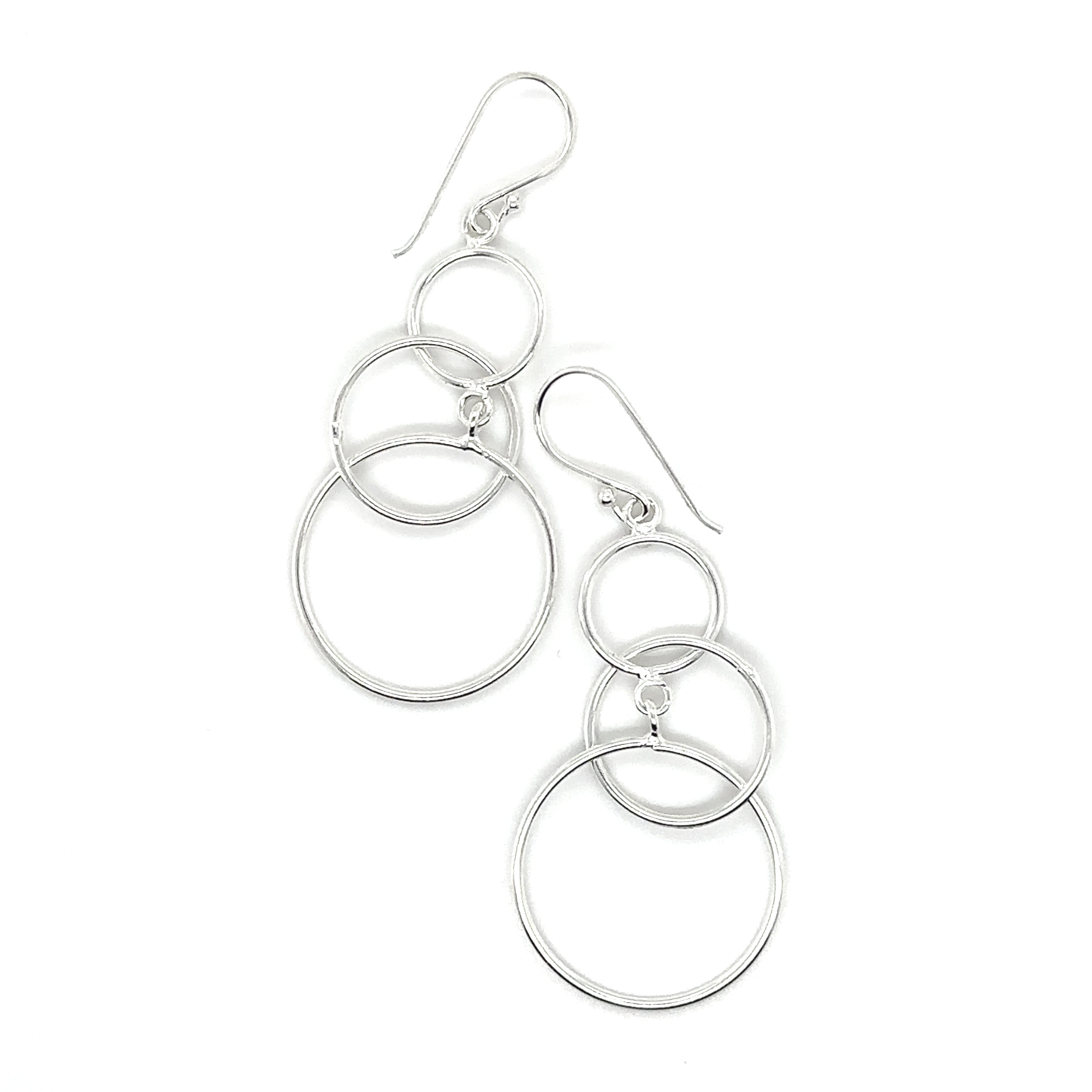 A pair of Interlocked Circles Earrings by Super Silver, perfect for dressing up on any occasion.