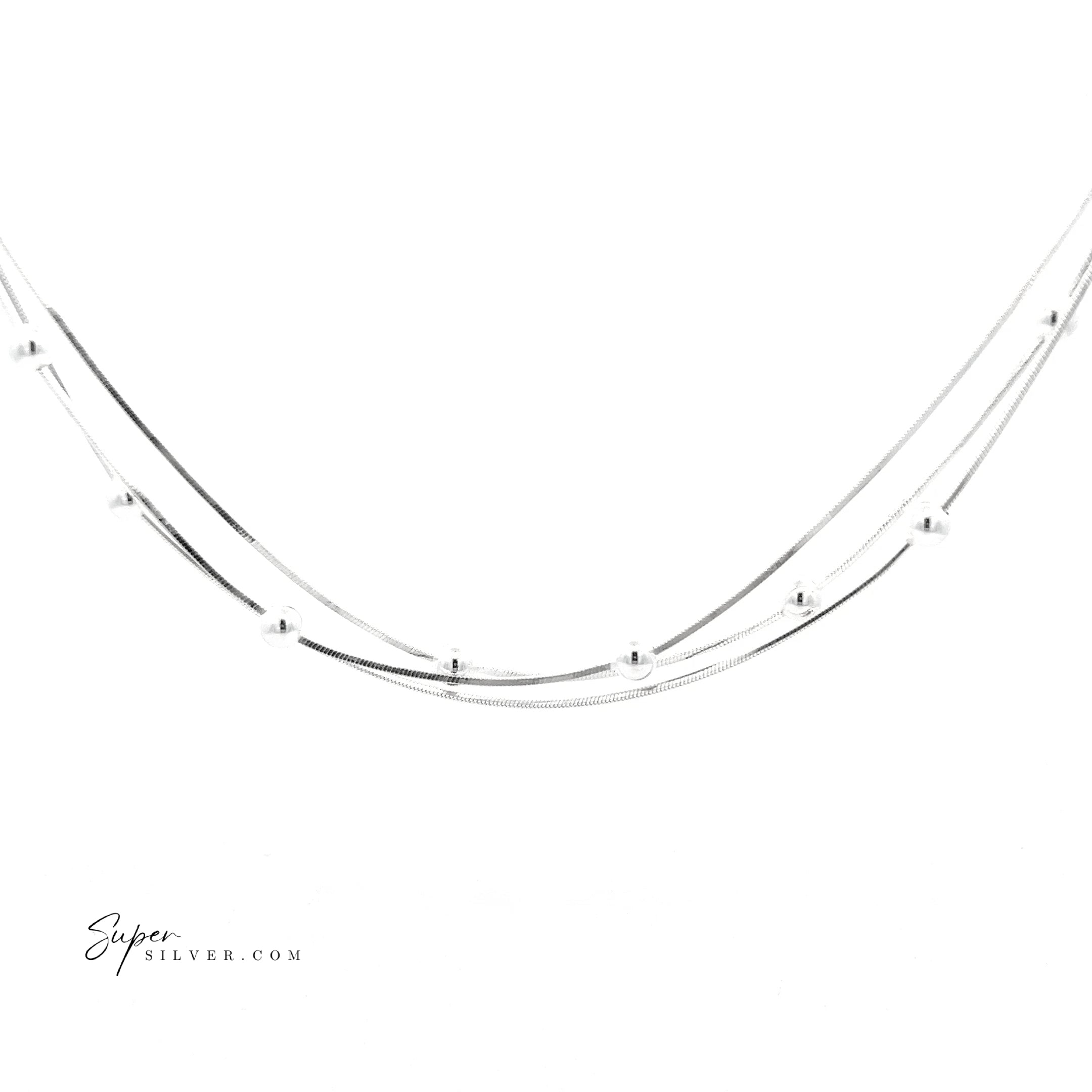 The Silver Serenade Necklace features a delicate Italian double-chain design with evenly spaced small round beads, shown on a white background.