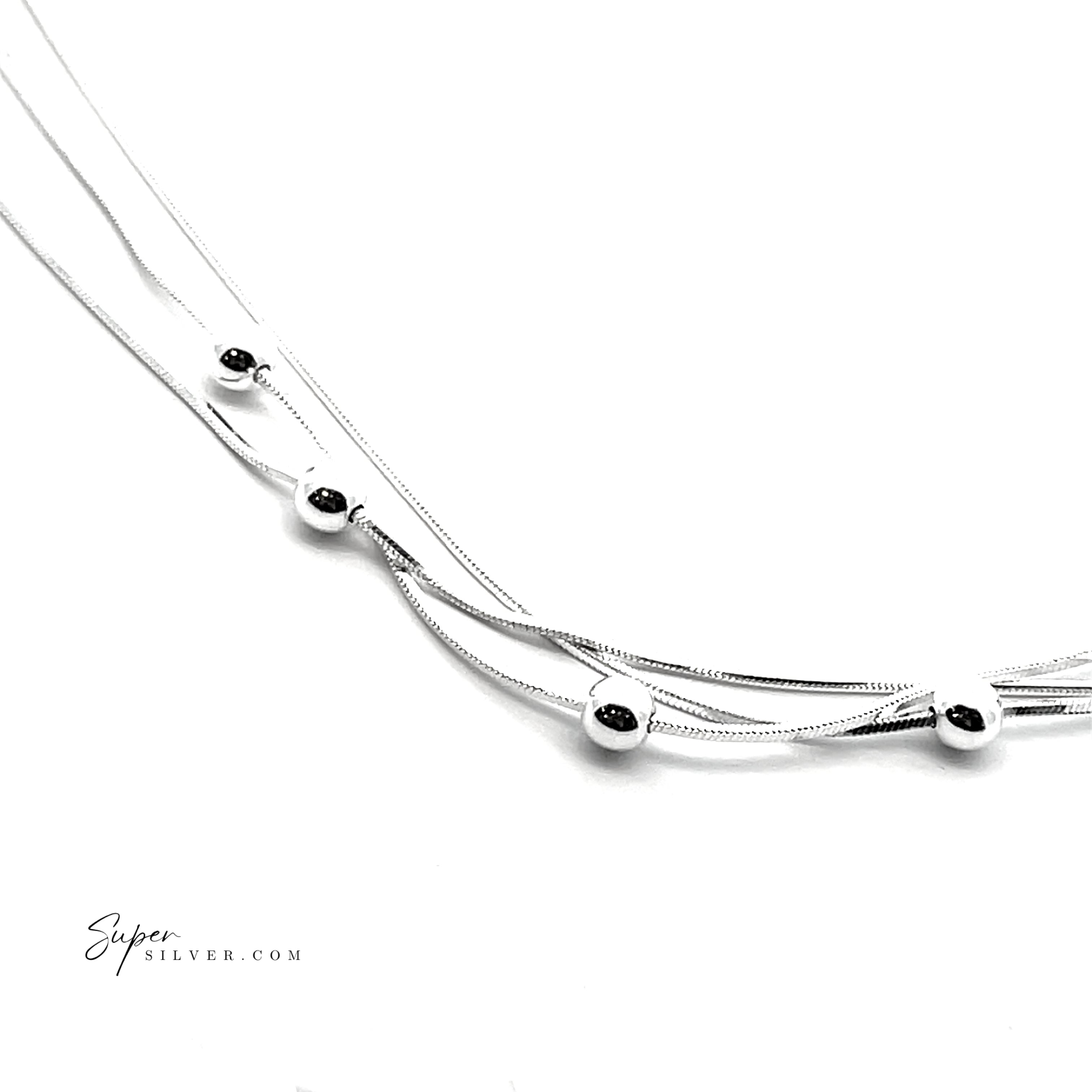 The Silver Serenade Necklace features five polished beads on a delicate Italian silver snake chain, shown against a white background with "SuperSilver.com" in the lower left corner.