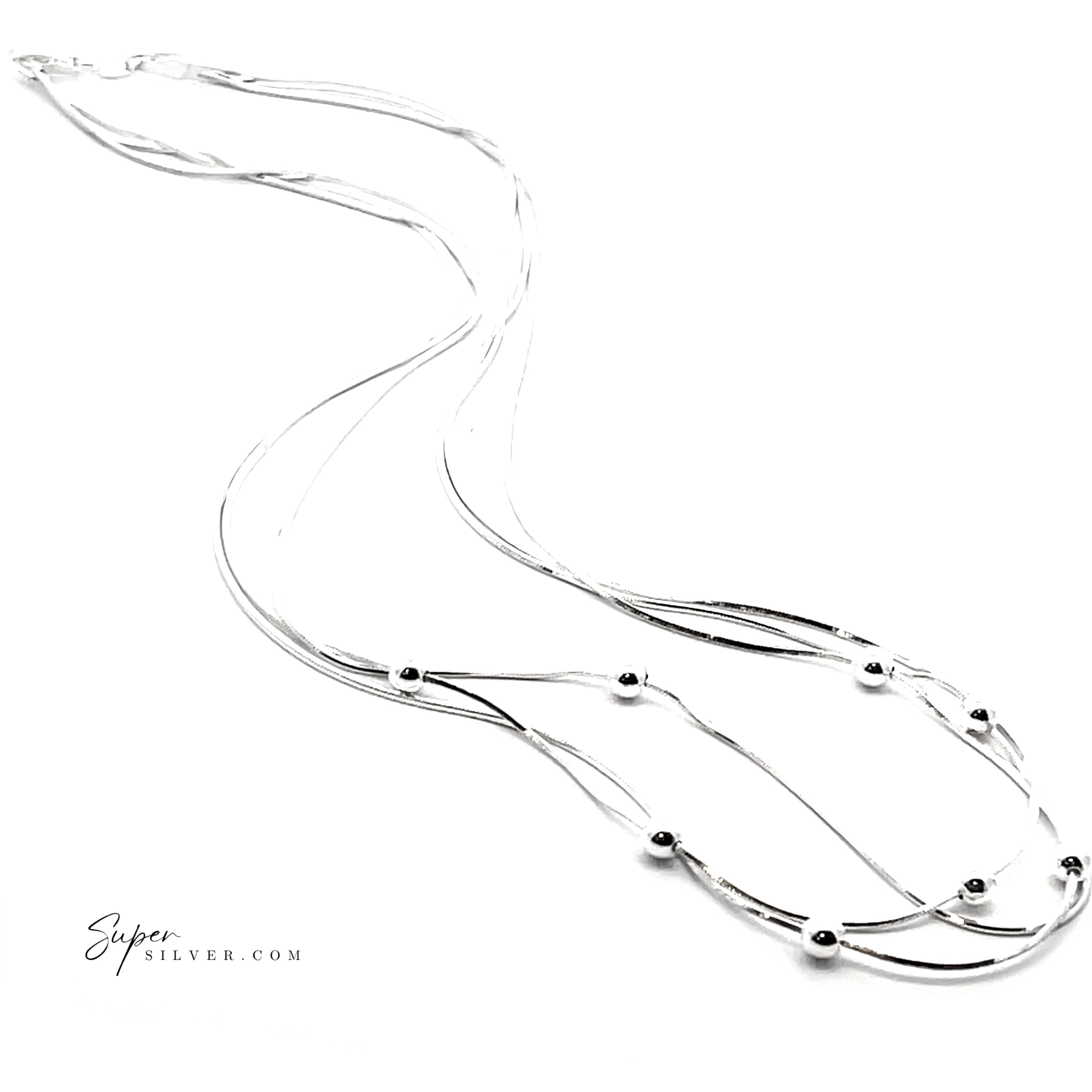 The Silver Serenade Necklace features layered Italian silver with smooth, curved strands and small round beads on a delicate snake chain. Displayed on white, "supersilver.com" appears in the lower left corner.