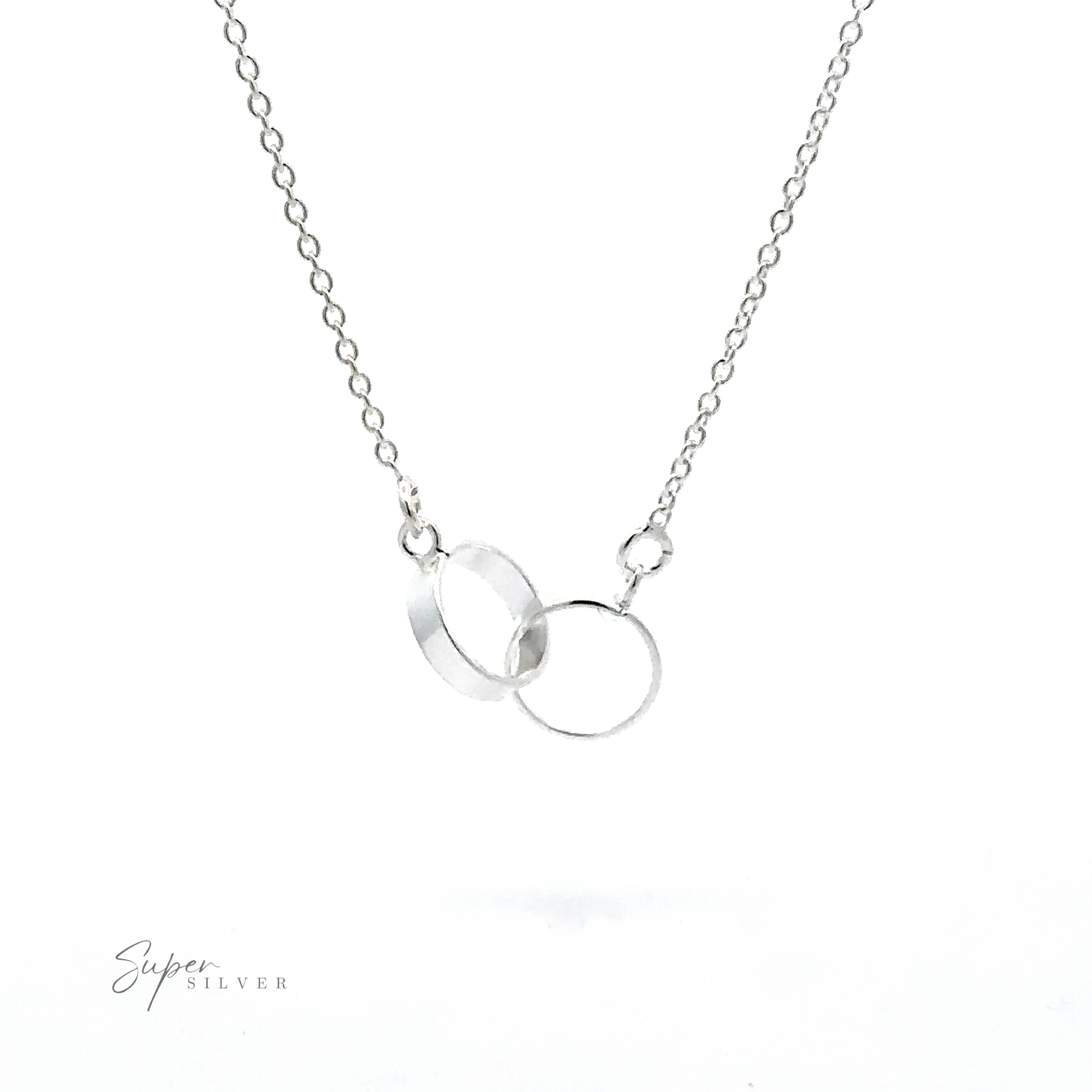 A Double Circle Necklace featuring two delicate interlocking rings on a fine chain, symbolizing an eternal bond. The image includes the logo "Super Silver" on the bottom left corner.
