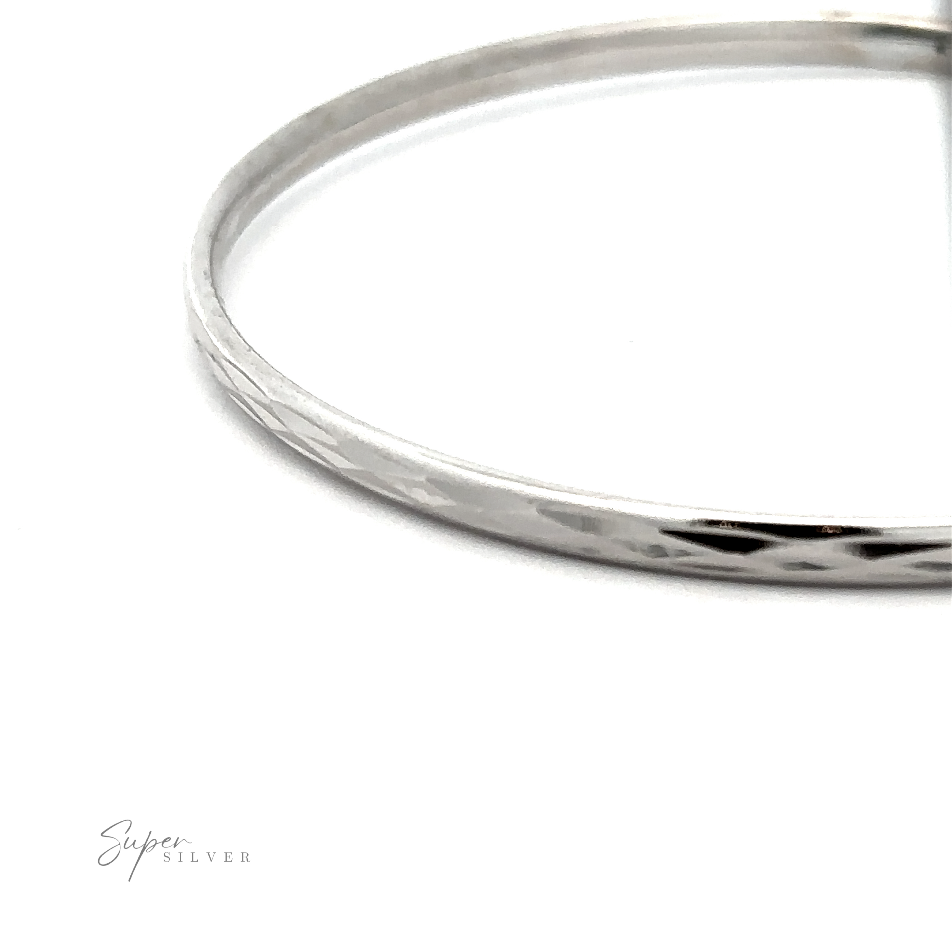 Close-up of Flashy 60mm Diamond Faceted Hoops with engraved patterns on a white background, featuring the text "super silver" in elegant script.