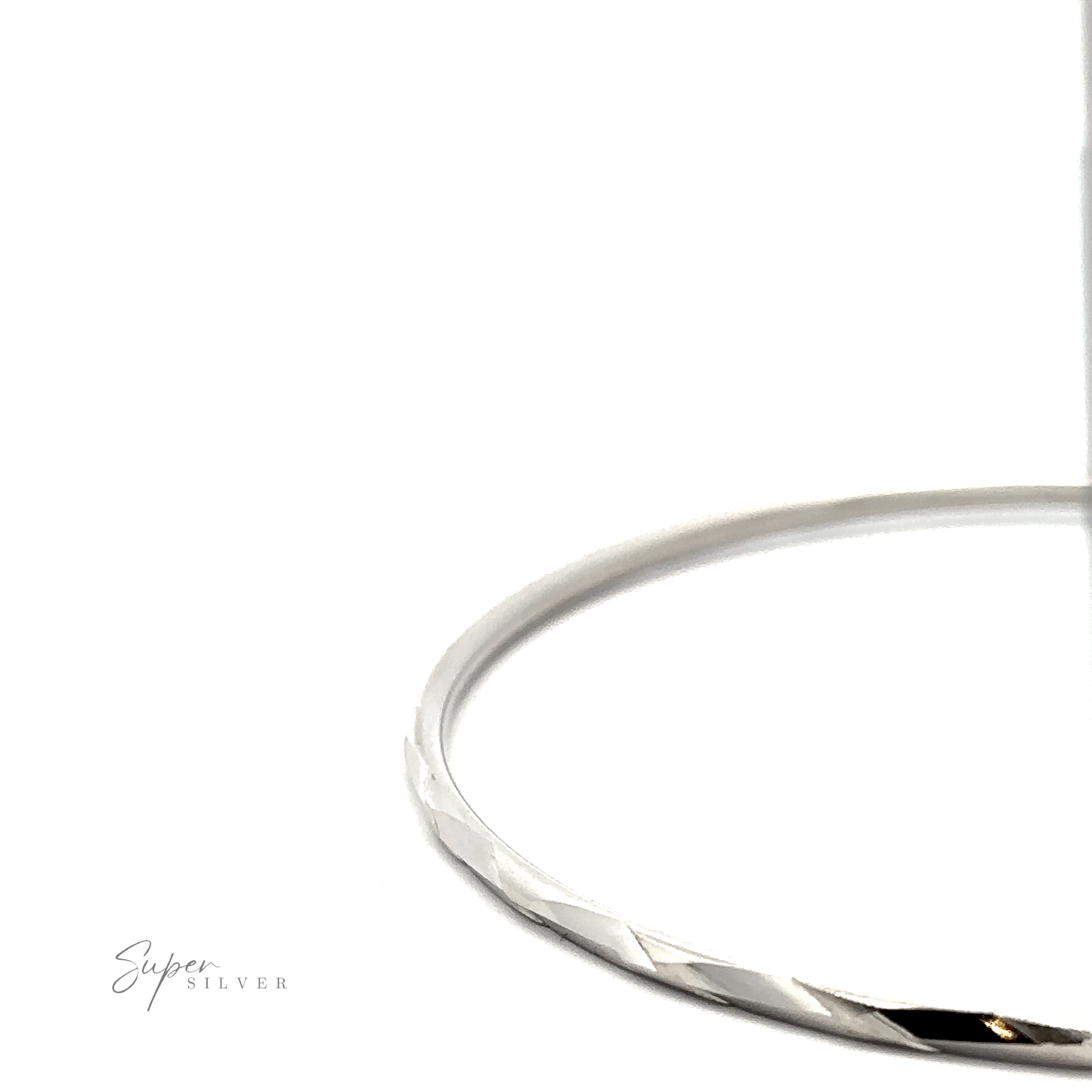 A Brilliant 60mm Rhodium Finish Faceted Hoops with a twisted design, partially in shadow, on a white background with the text "super silver.