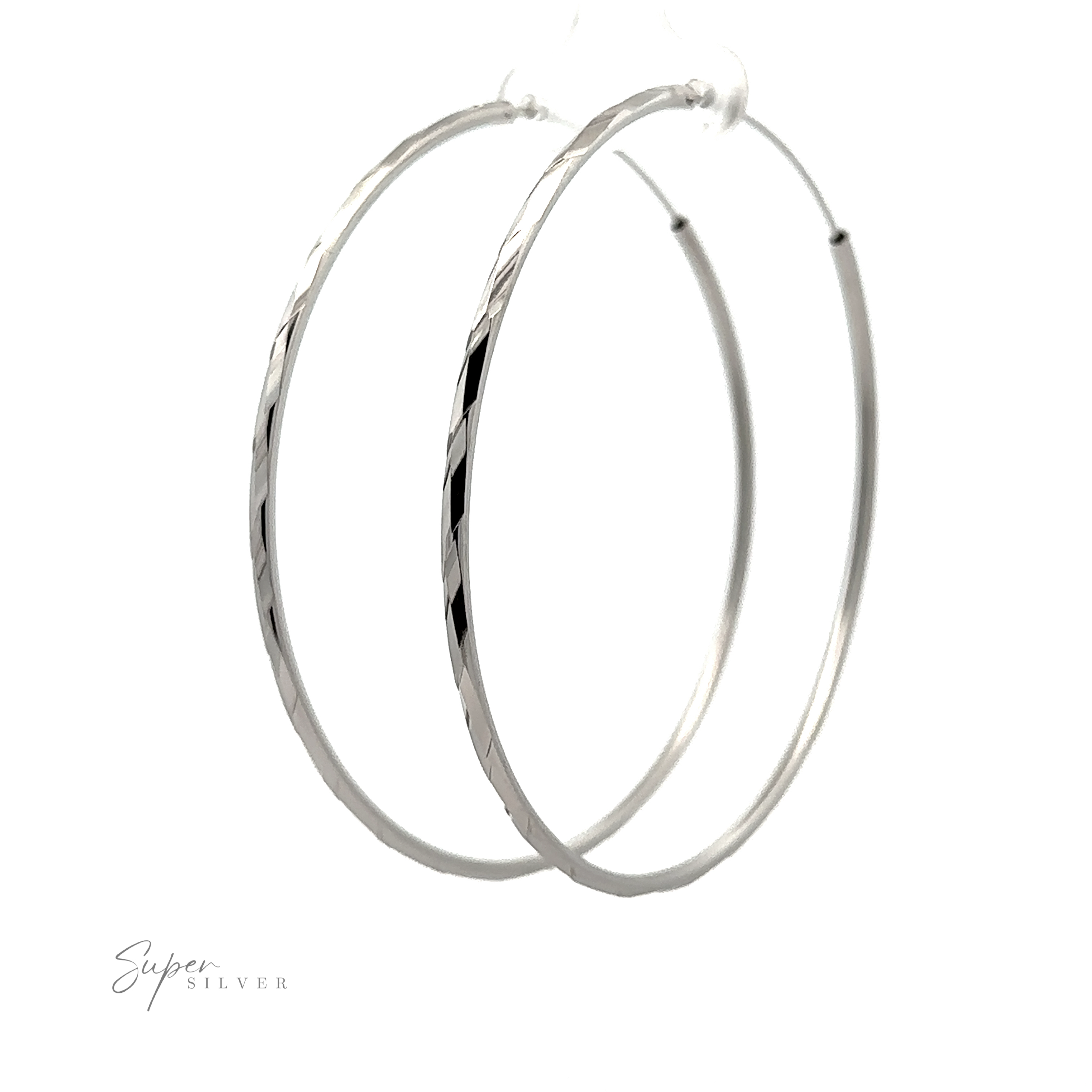 A pair of Brilliant 60mm Rhodium Finish Faceted Hoops displayed against a white background, with a signature "super silver" at the bottom left.