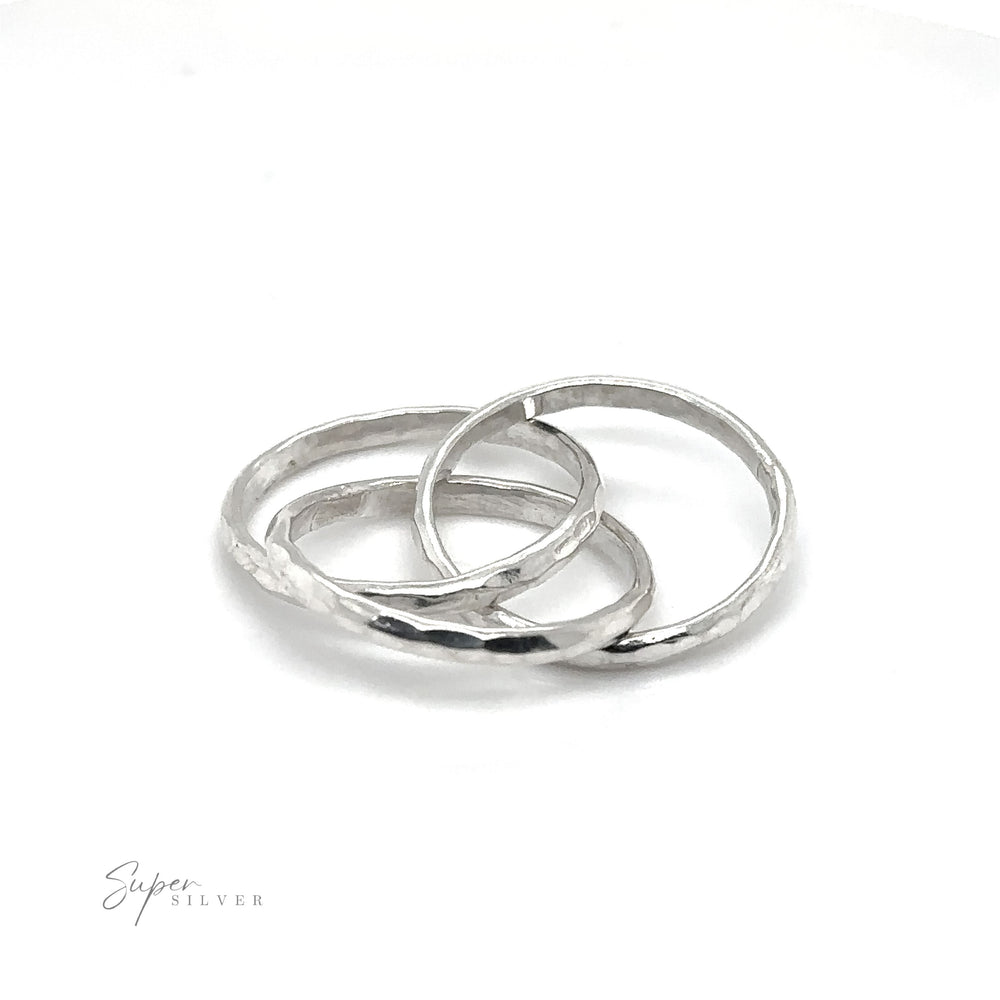 Three 2mm Hammered Triple Rolling Rings on a white background.