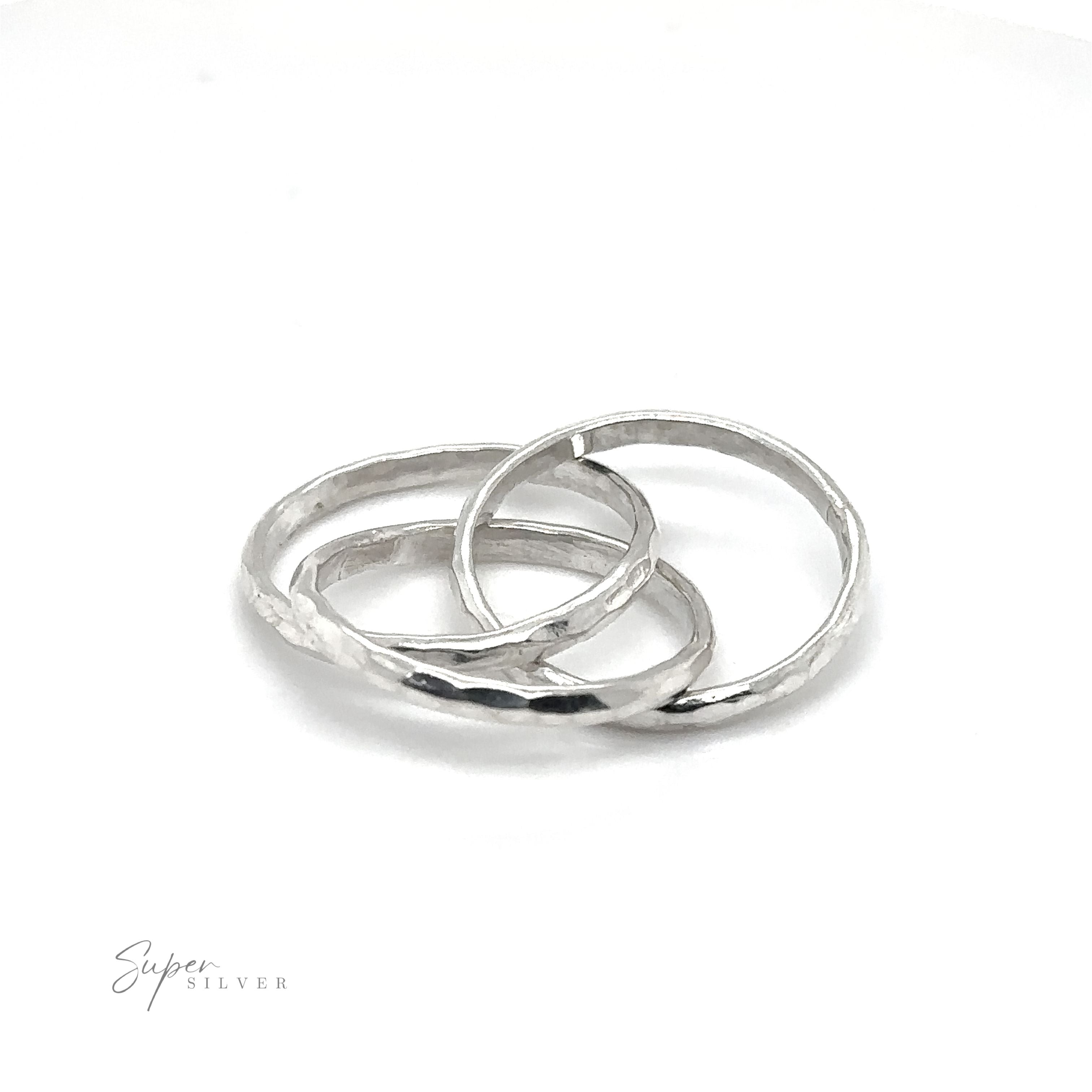 Three 2mm Hammered Triple Rolling Rings on a white background.
