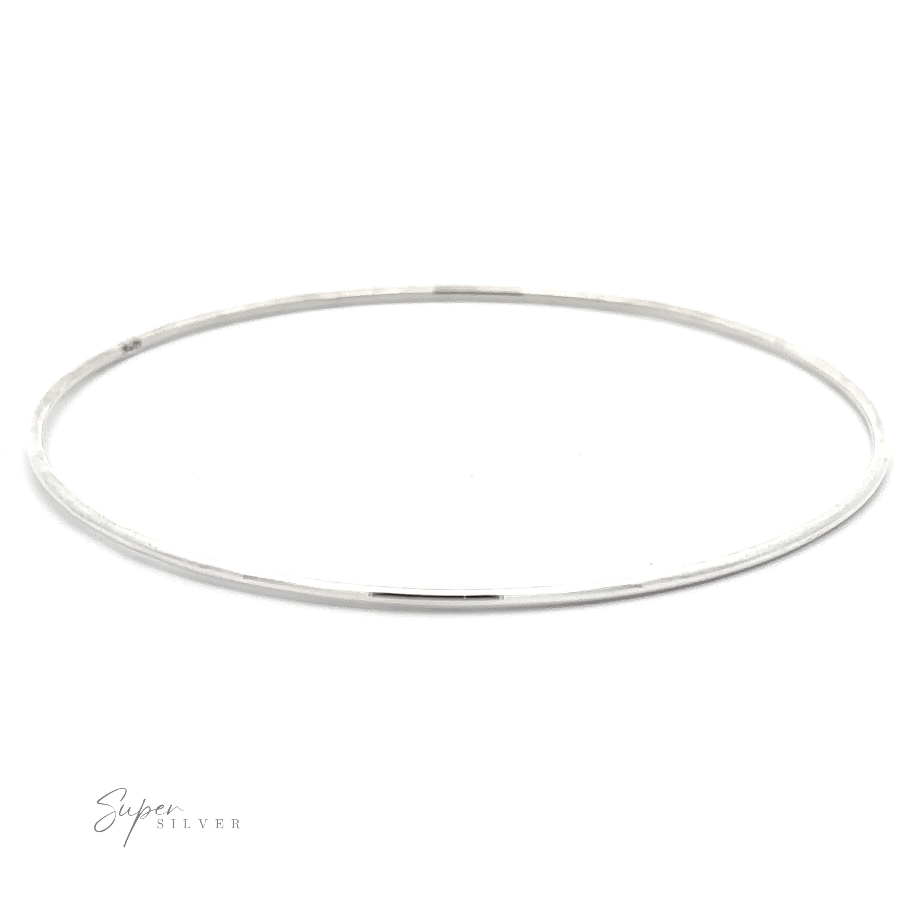 A thin, Plain Bangle with a smooth, polished finish is displayed on a white background. The logo "Super Silver" is visible in the lower left corner, emphasizing its appeal as a versatile accessory.