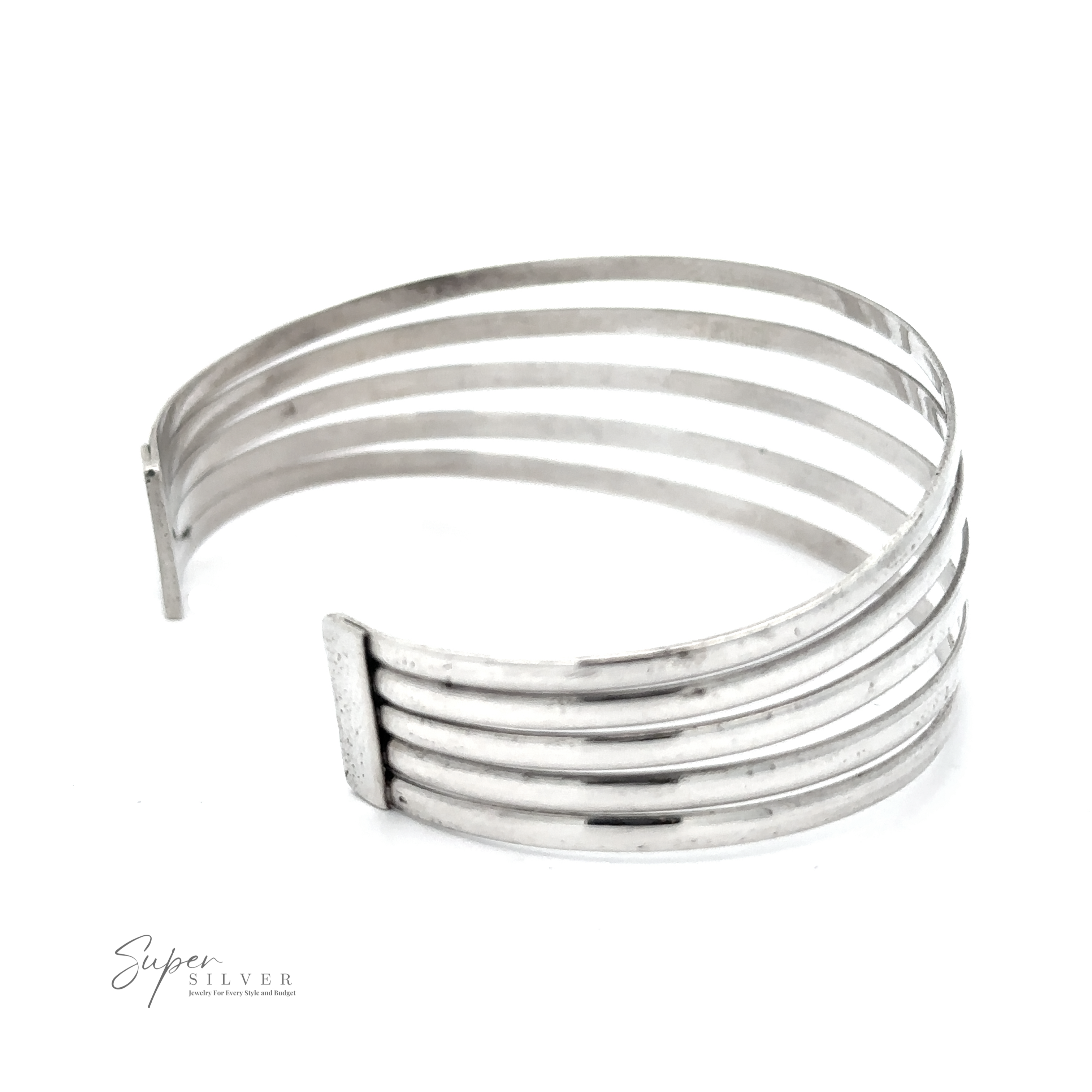A fashionable Simple Cuff with Open Design featuring parallel horizontal bars and an open end design. Crafted from .925 Sterling Silver, the silver cuff boasts the "Super Silver" logo printed in the lower left corner, exuding a modern chic appeal.