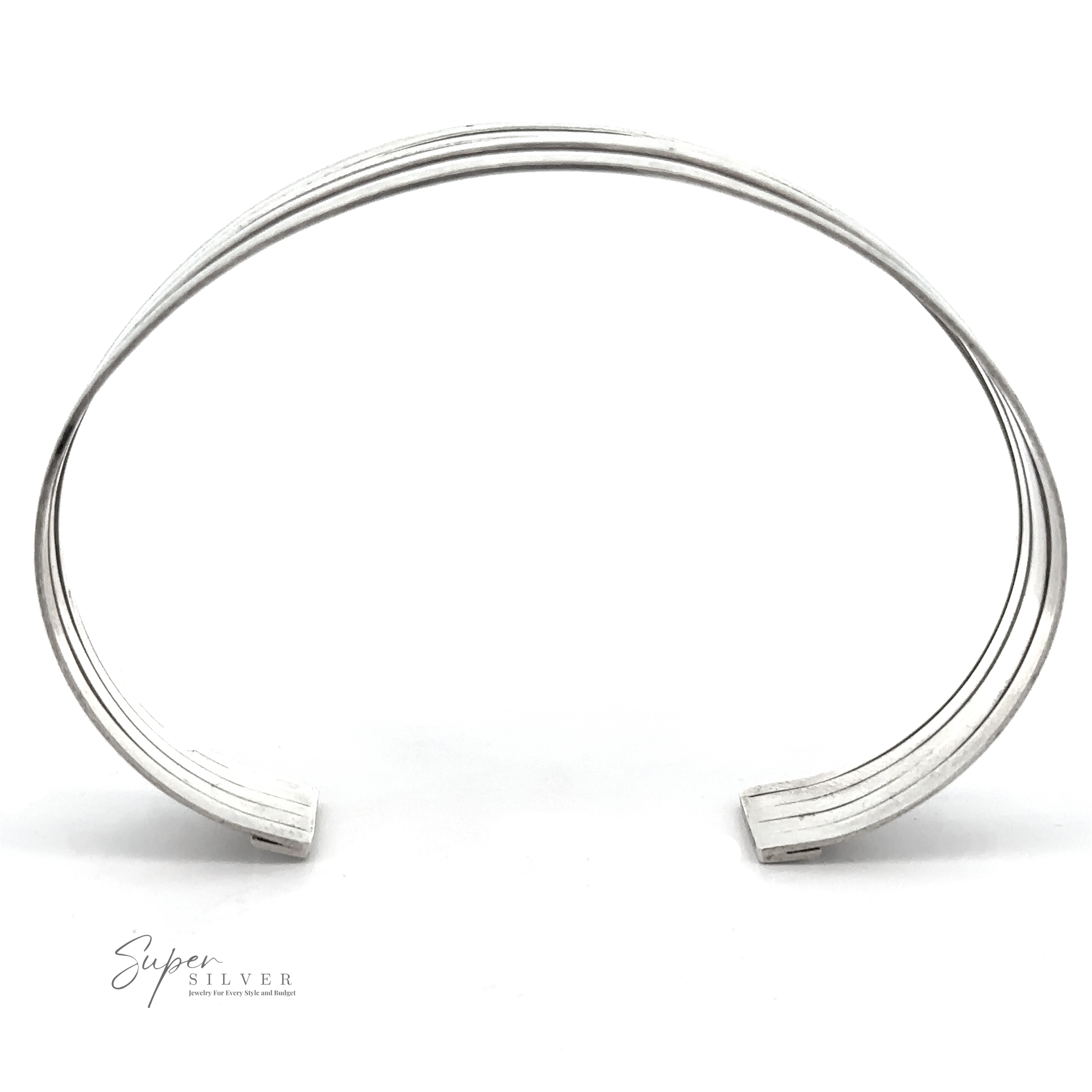 A minimalist, modern chic Simple Cuff with Open Design .925 Sterling Silver bracelet with thin, parallel lines engraved along its surface. The fashionable cuff is open-ended with slightly curved edges and the words "Super Silver" are faintly visible in the bottom left corner.