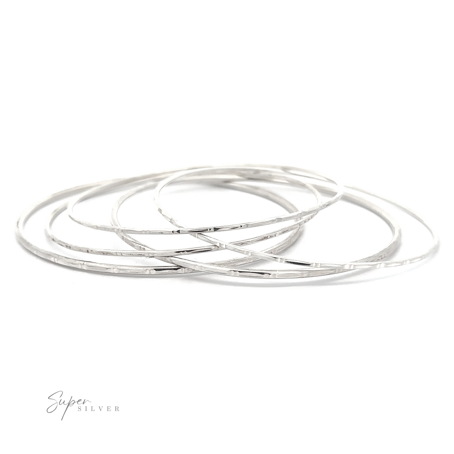 
                  
                    A set of five Sparkling Faceted Bangle Bracelets arranged in an overlapping fashion on a white background. The surface appears smooth and shiny.
                  
                