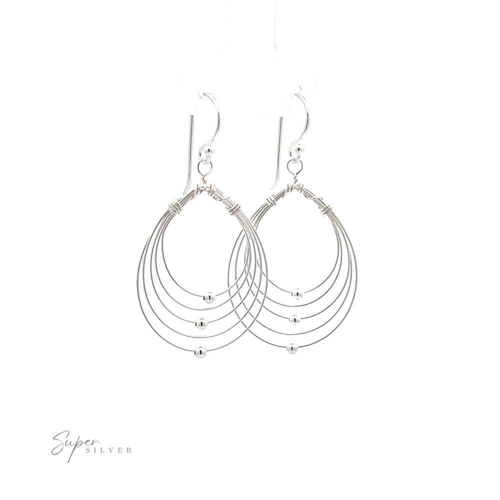A pair of lightweight Wire Teardrop Dangle Earrings on a white background.