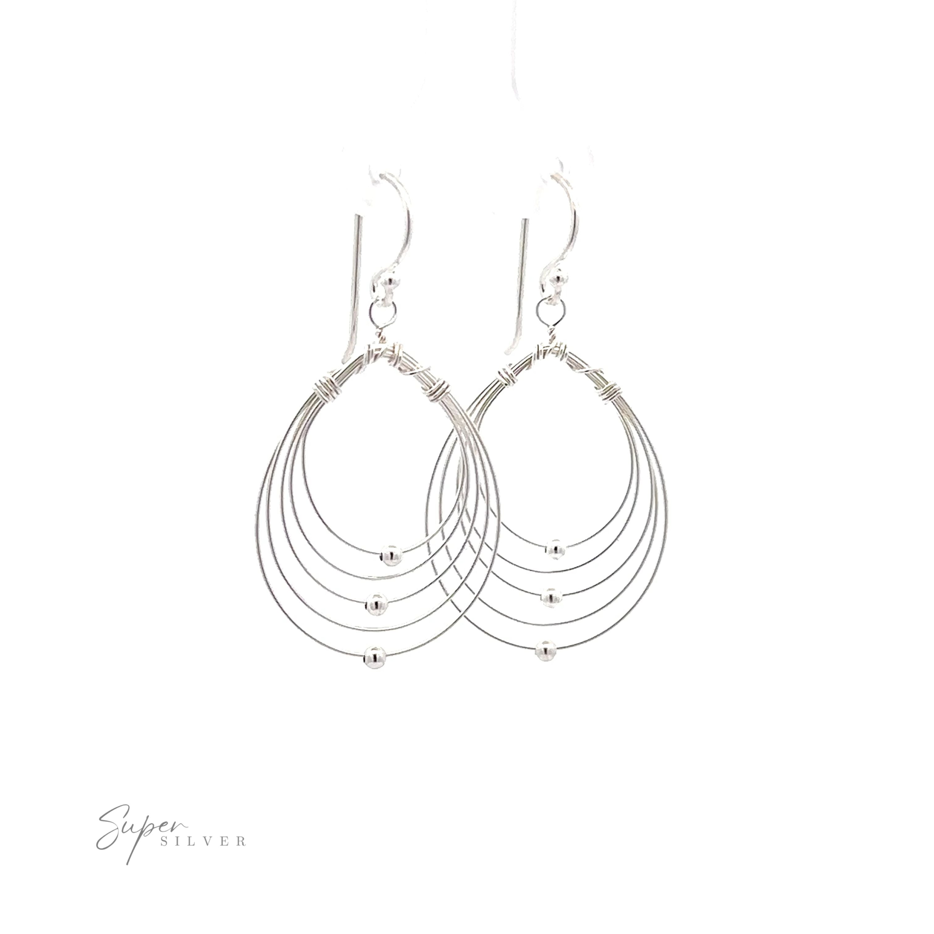 A pair of lightweight Wire Teardrop Dangle Earrings on a white background.