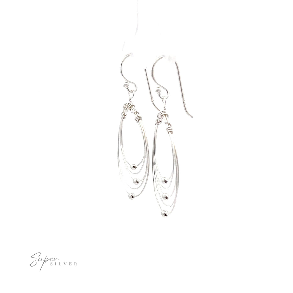 
                  
                    Wire Teardrop dangle earrings on a white background.
                  
                