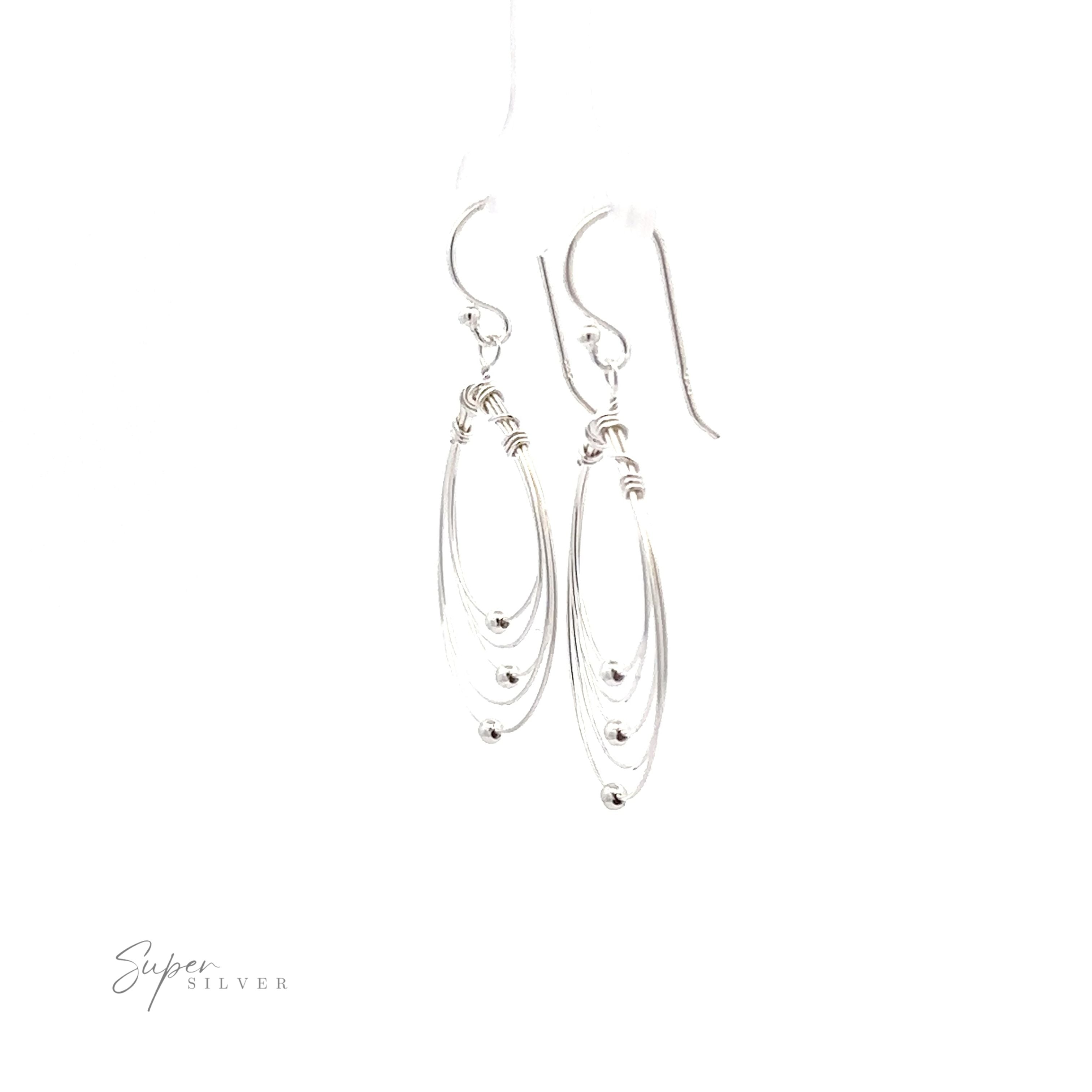 Wire Teardrop dangle earrings on a white background.
