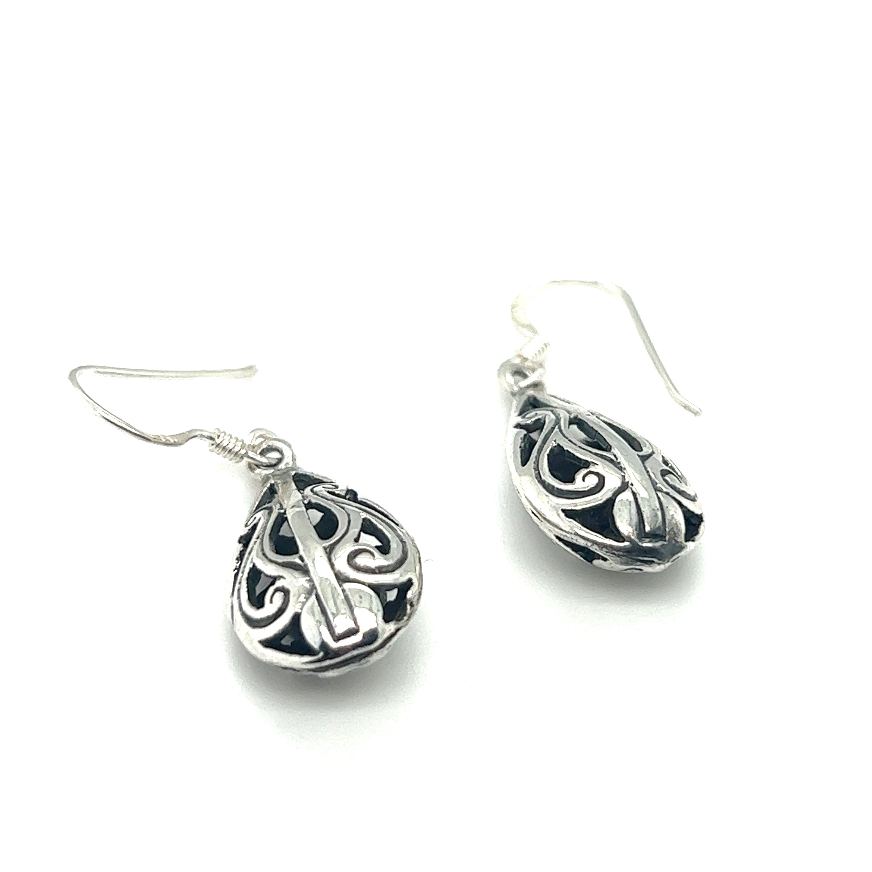 A pair of Super Silver Filigree Teardrop Earrings with an ornate filigree design.