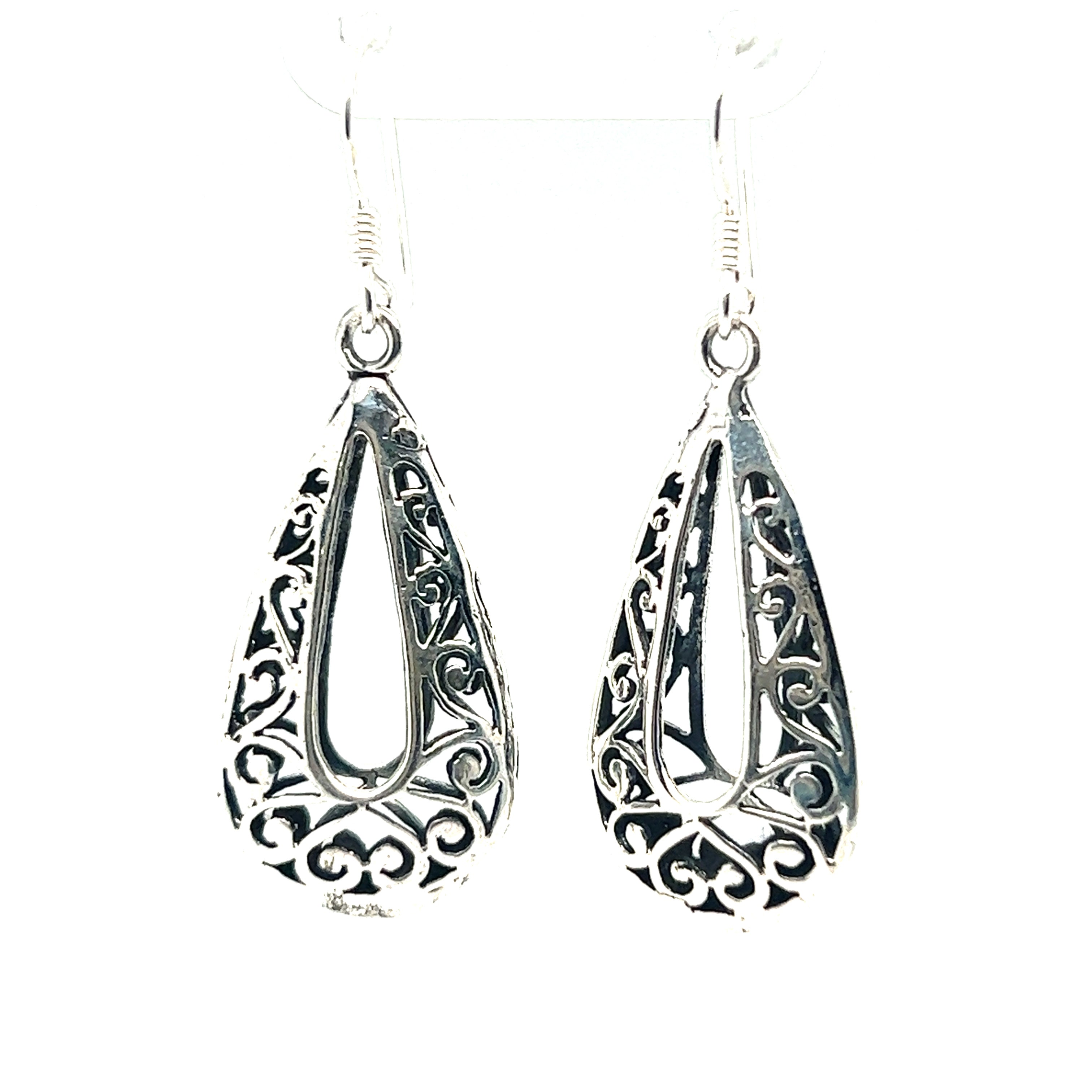 A pair of Super Silver Filigree Teardrop Earrings with Open Center, adding bohemian flair to any outfit.