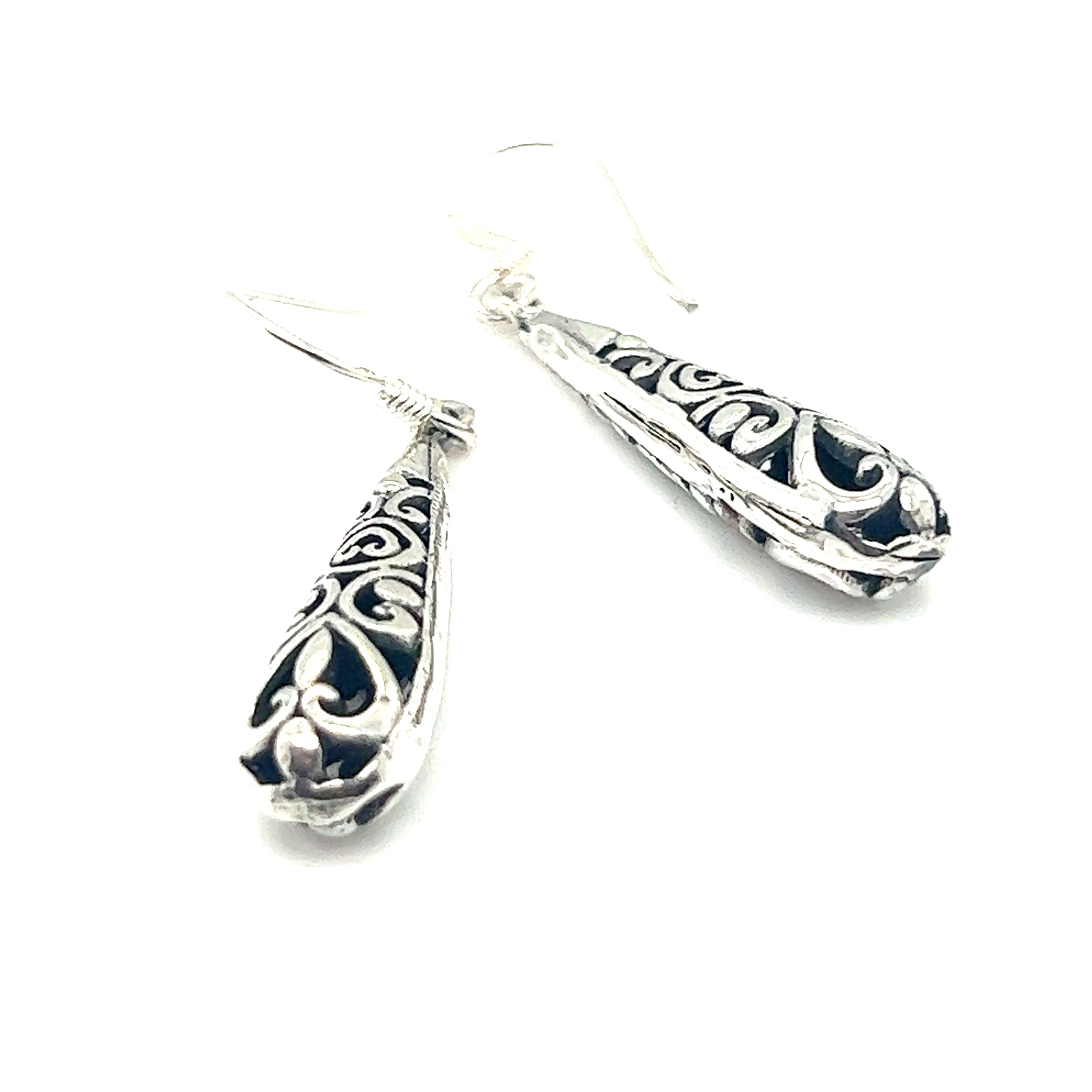 A pair of Super Silver Filigree Teardrop Earrings with ornate filigree designs.