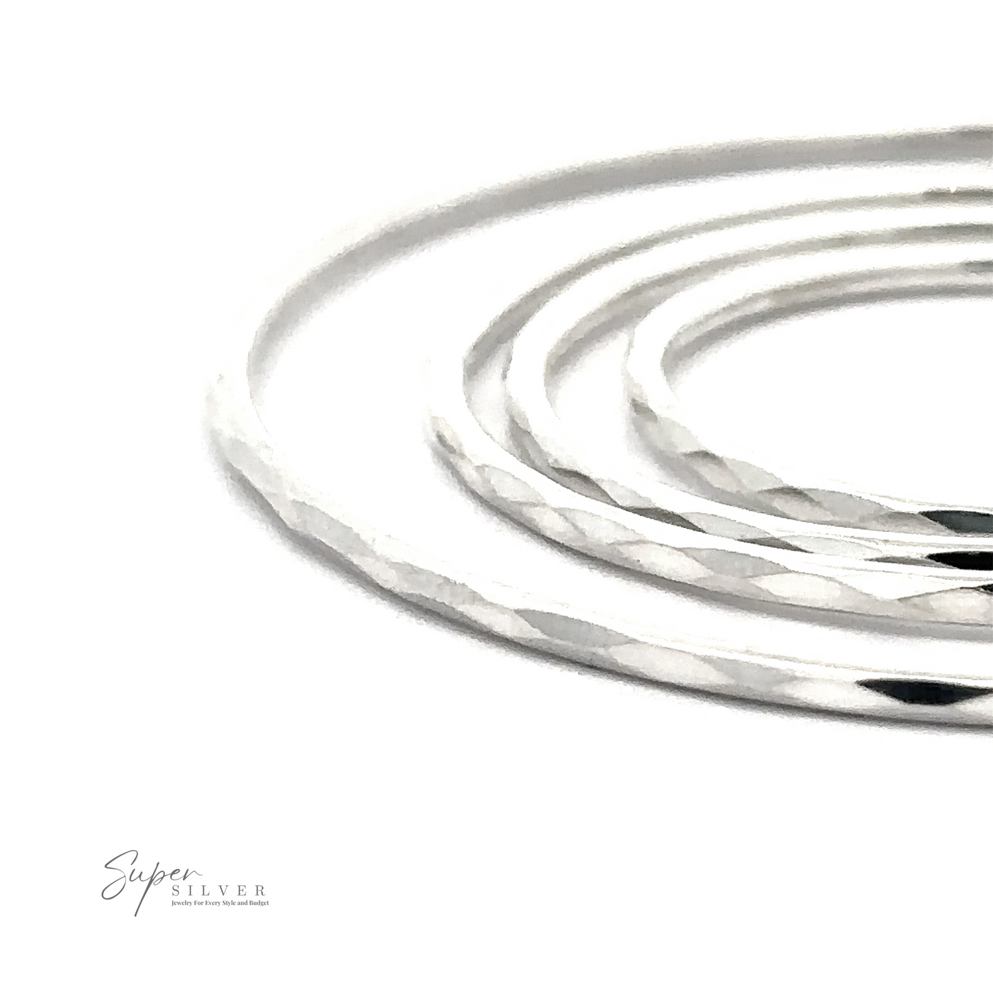 Close-up of 1.5mm Faceted Silver Infinity Hoops with a rhodium finish, displayed against a white background with a logo reading "super silver.