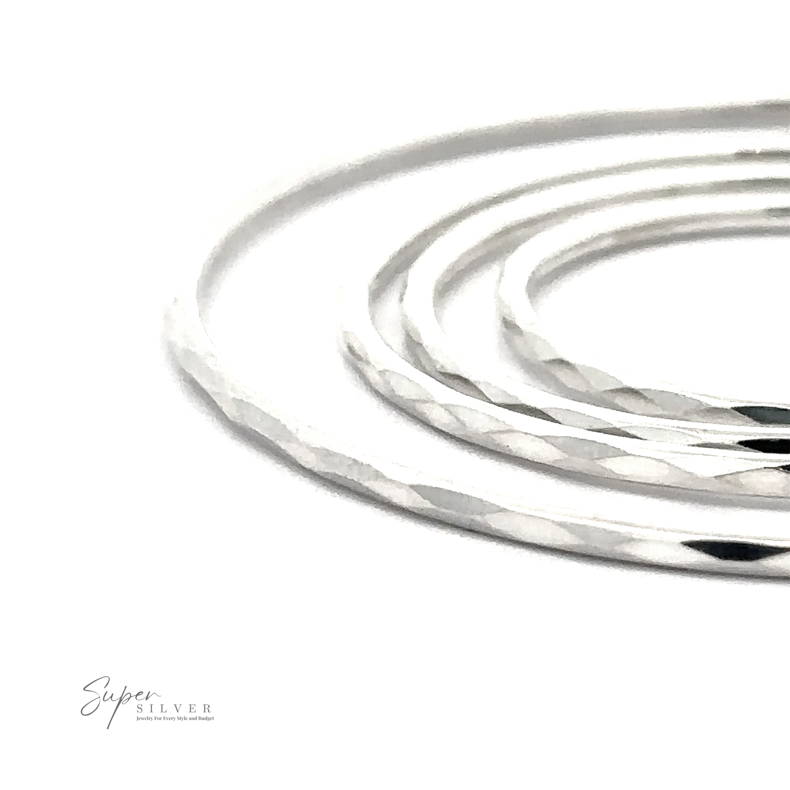Close-up of 1.5mm Faceted Silver Infinity Hoops with a rhodium finish, displayed against a white background with a logo reading "super silver.