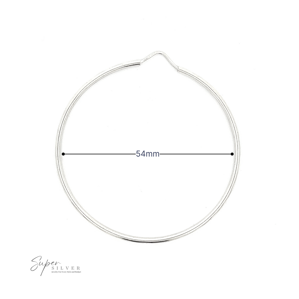 
                  
                    1.5mm Faceted Silver Infinity Hoops crafted from .925 Sterling Silver with a 54mm diameter, displayed on a white background with a brand signature at the bottom right.
                  
                