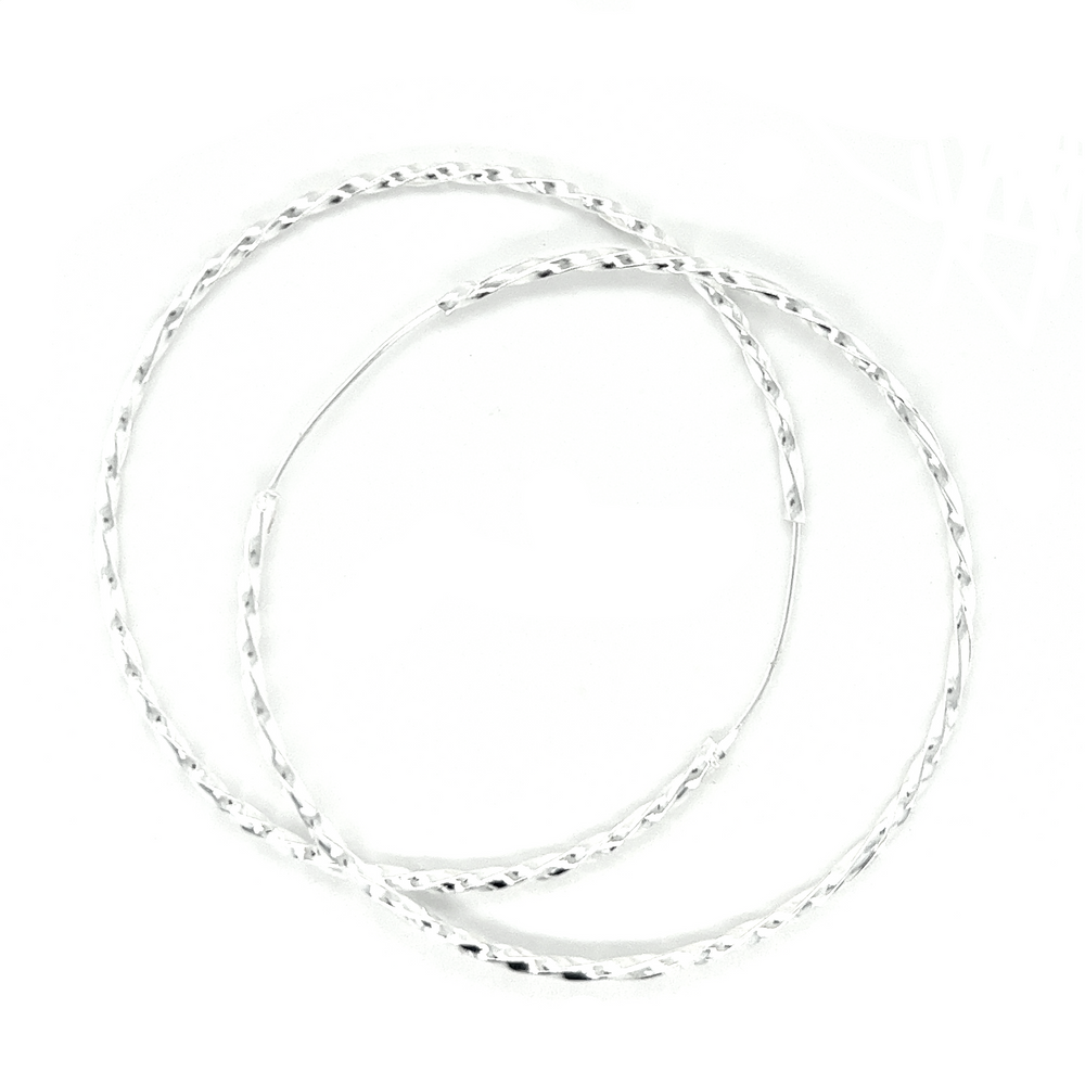 
                  
                    Three intertwined 70mm Twisted Hoops bangle bracelets with a twisted design, displayed against a white background.
                  
                