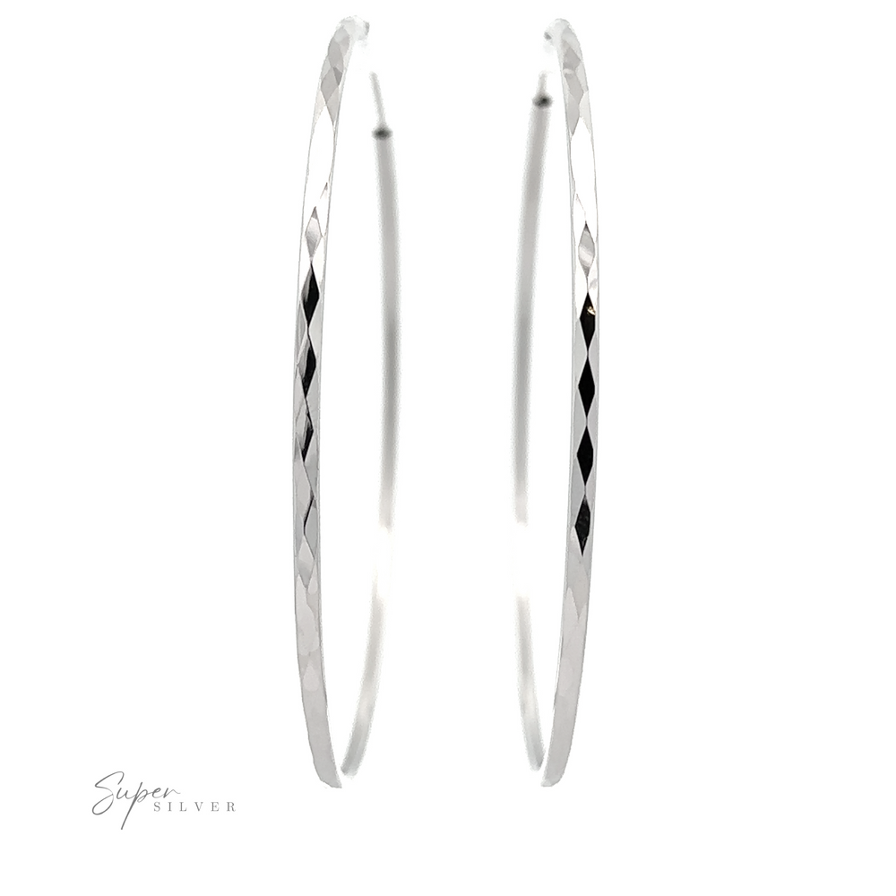 A pair of 2mm Diamond Faceted Hoops with a rhodium finish, isolated on a white background with a 