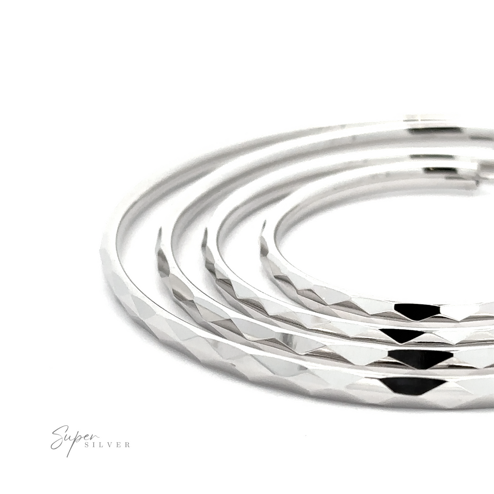 Four polished 3mm Thick Rhodium Finished Diamond Faceted Hoops are arranged in a circular pattern on a plain white background with "Super Silver" branding visible in the corner.