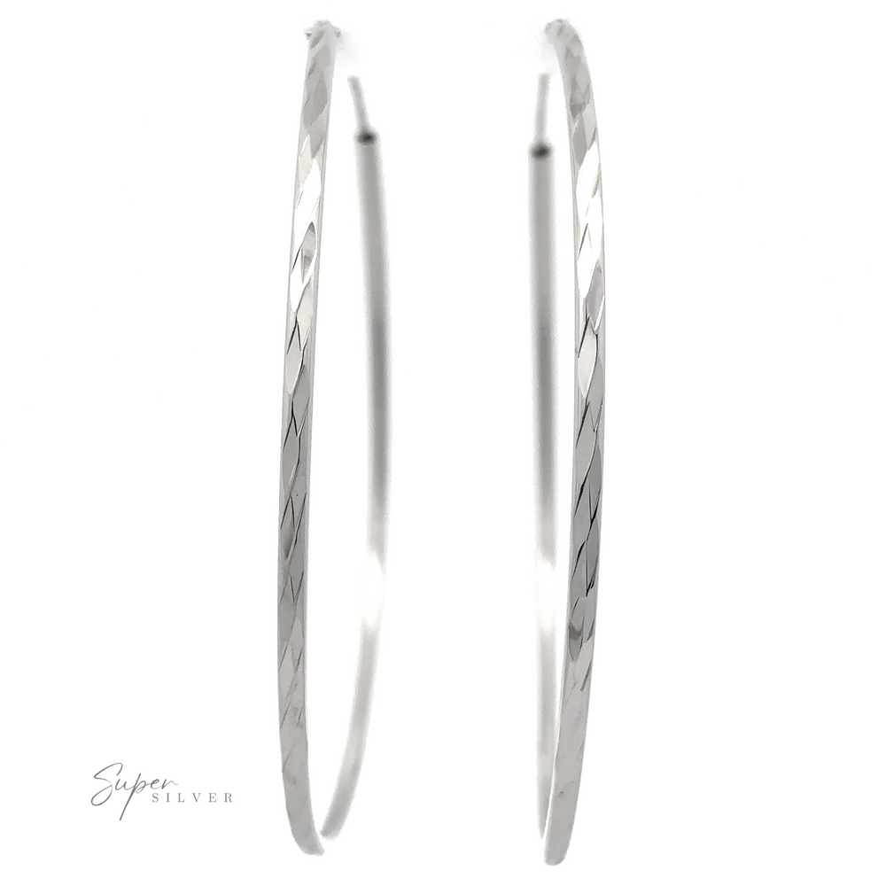 Sparkling 2mm Faceted Twisted Hoops with a subtle textured pattern, shown on a white background. Brand "Super Silver" logo is at the bottom left corner.