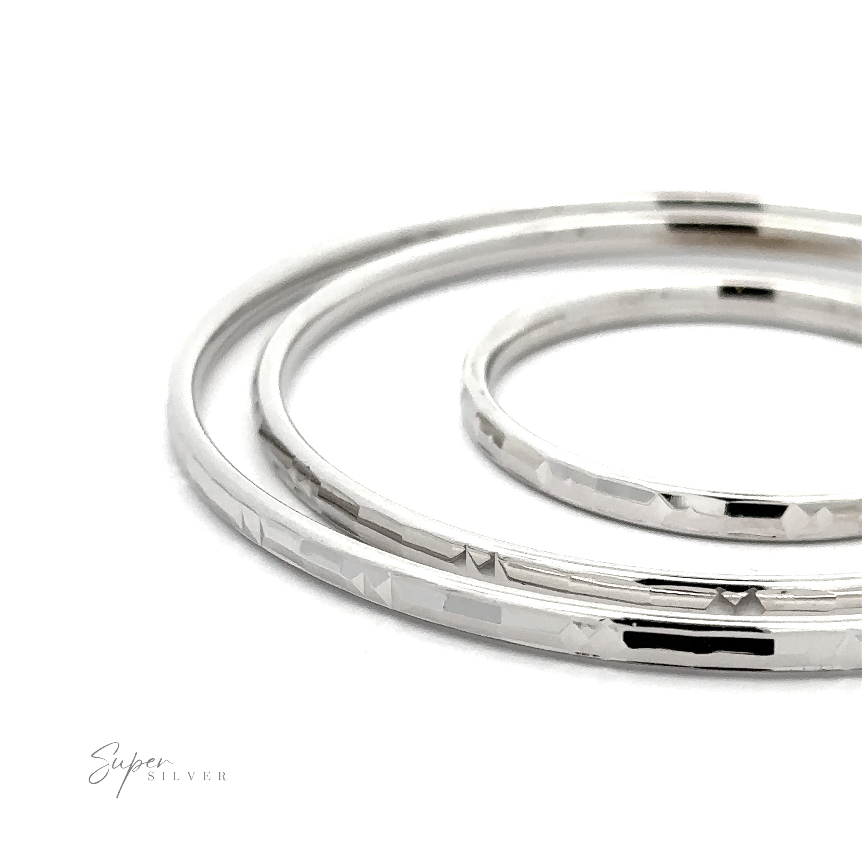 Three stacked Modern 3mm Rhodium Finish Facet Hoops, displayed against a white background with a logo "super silver" in script.