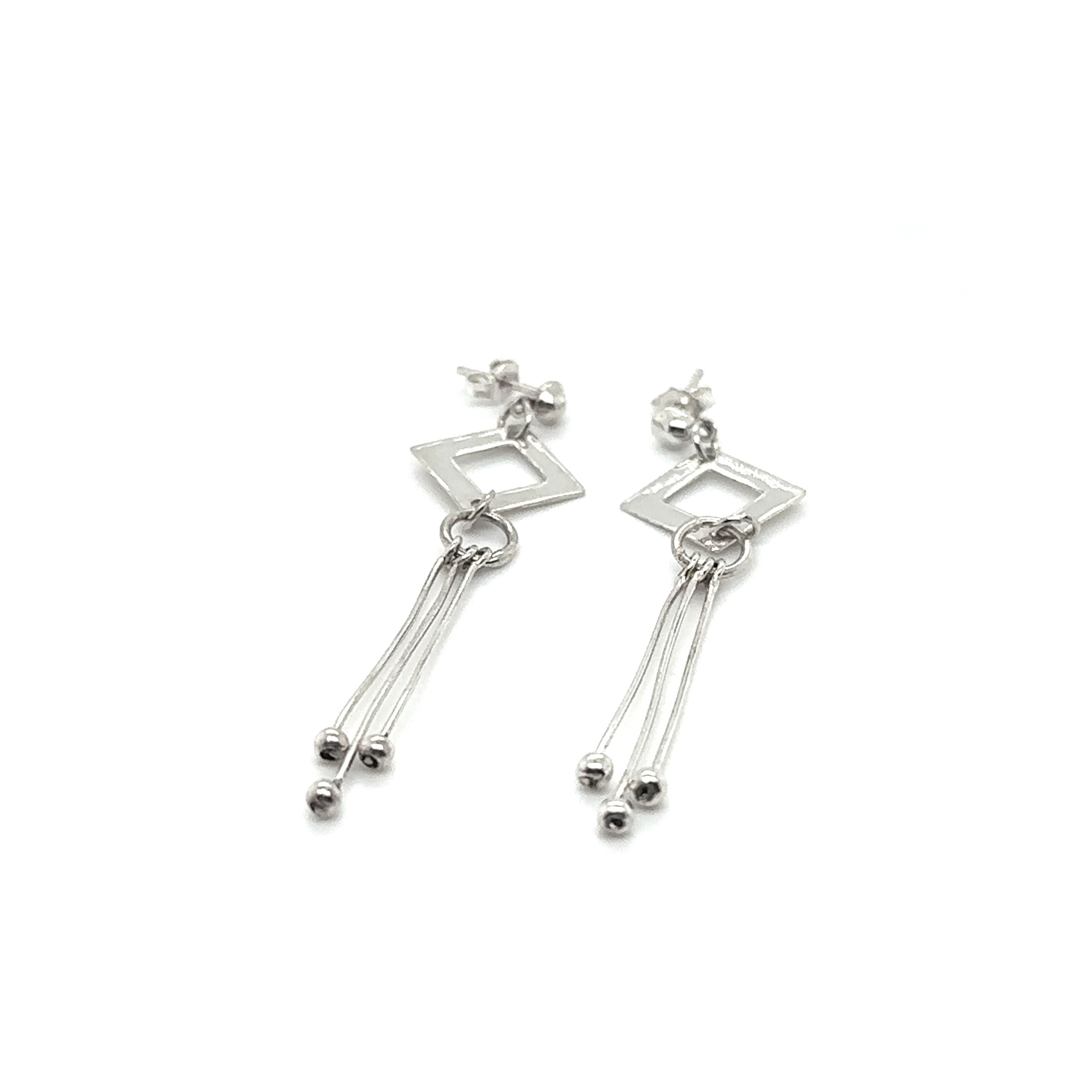 A pair of Diamond Shaped Post Earrings with Tassel by Super Silver.