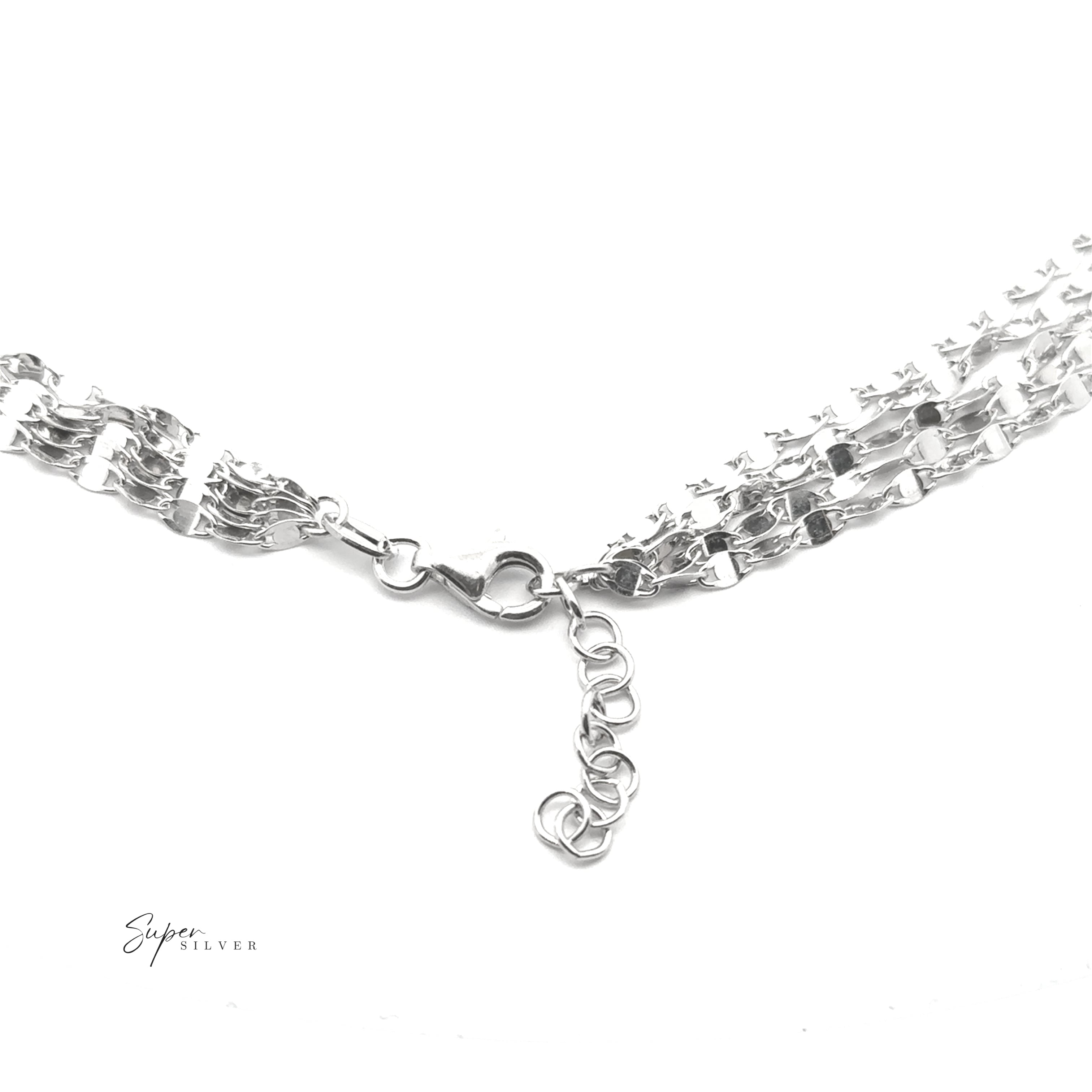 Close-up of the La Notte Grande Necklace, an Italian design with cascading sterling silver chains, lobster clasp, and extension links, shown on a white background.