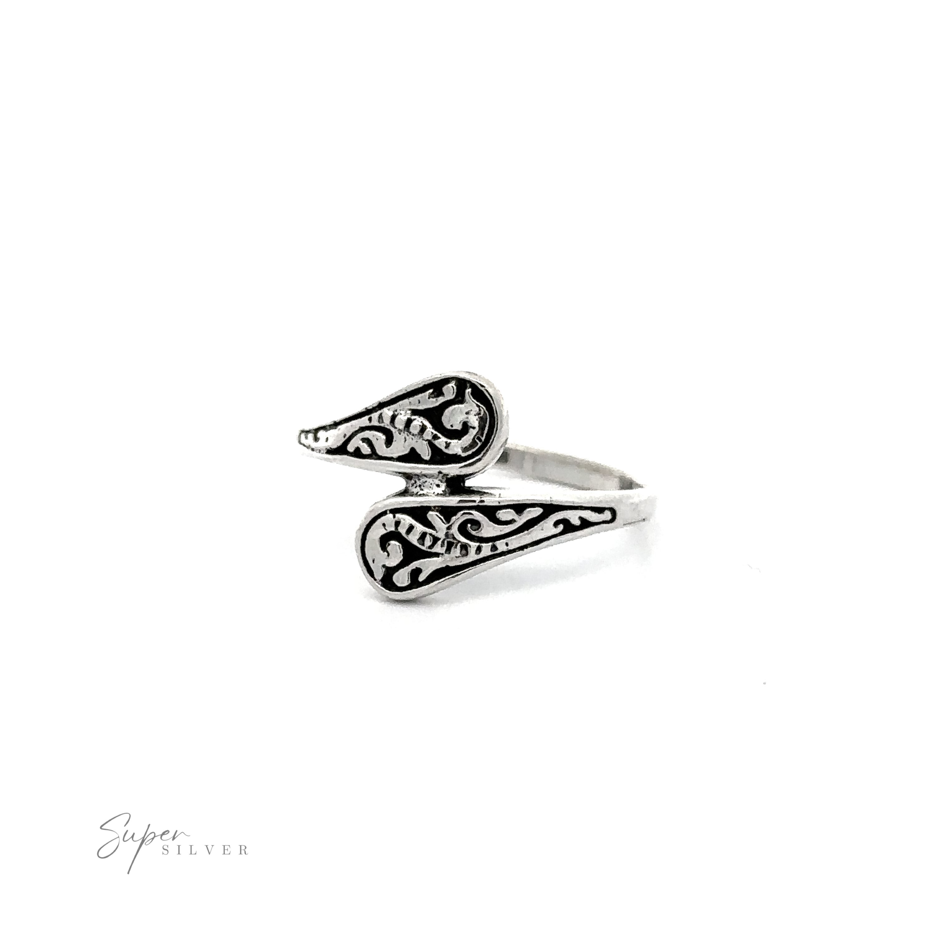 A Dainty Spoon Ring with an ornate swirl design and oxidized finish.