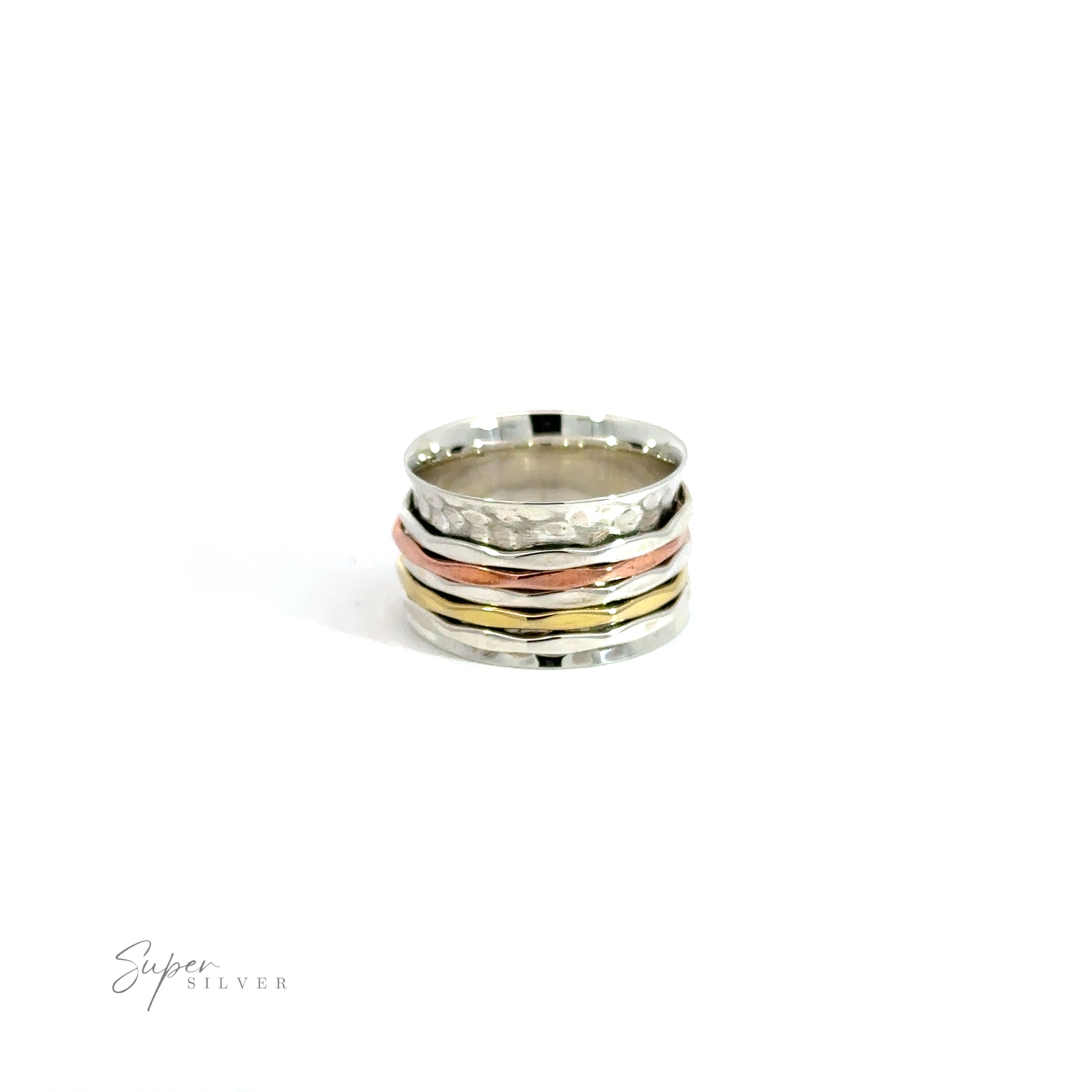 A stack of Handmade Hammered Tricolor Spinner Rings on a white background.