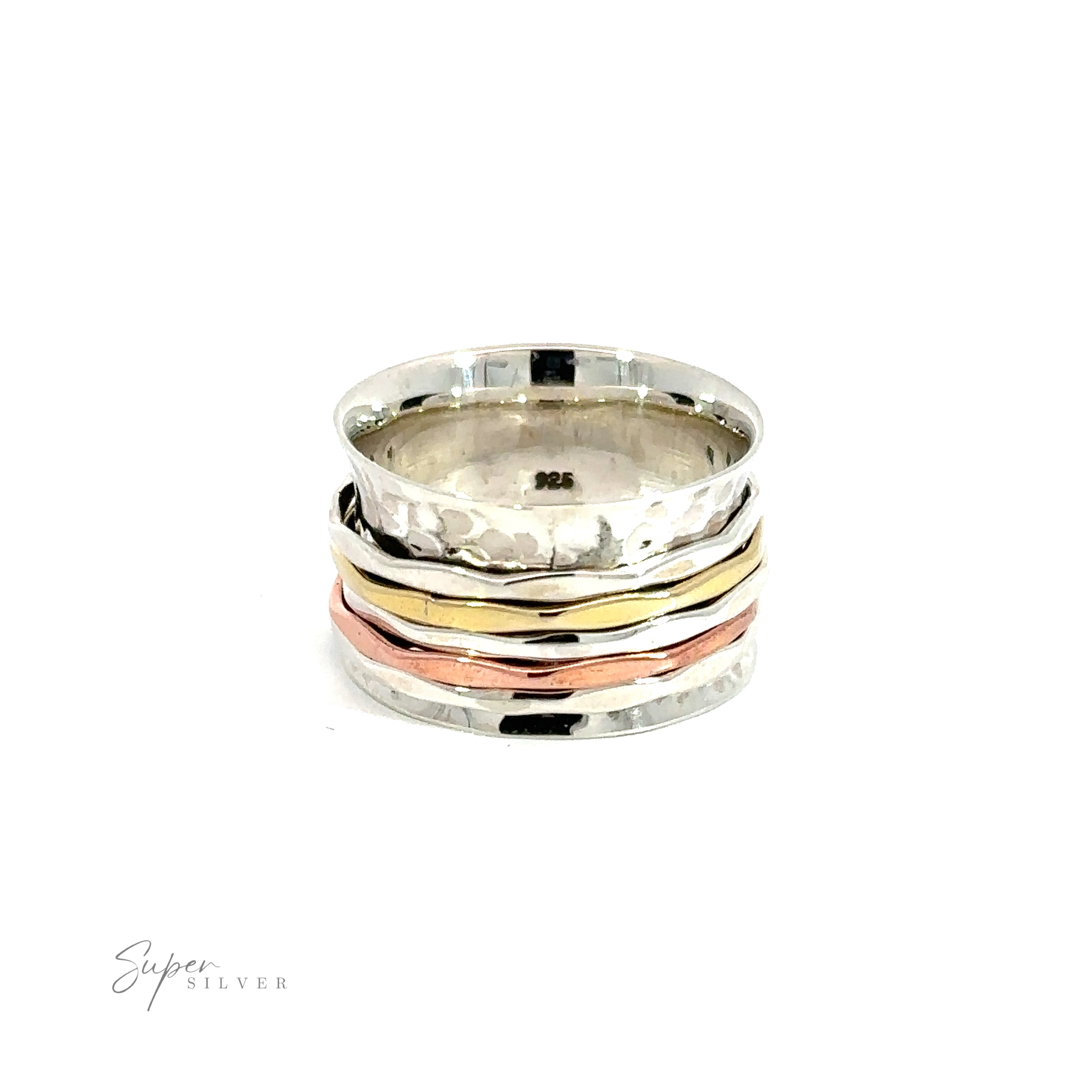 A stack of Handmade Hammered Tricolor Spinner Rings, including sterling silver and gold, on a white background.