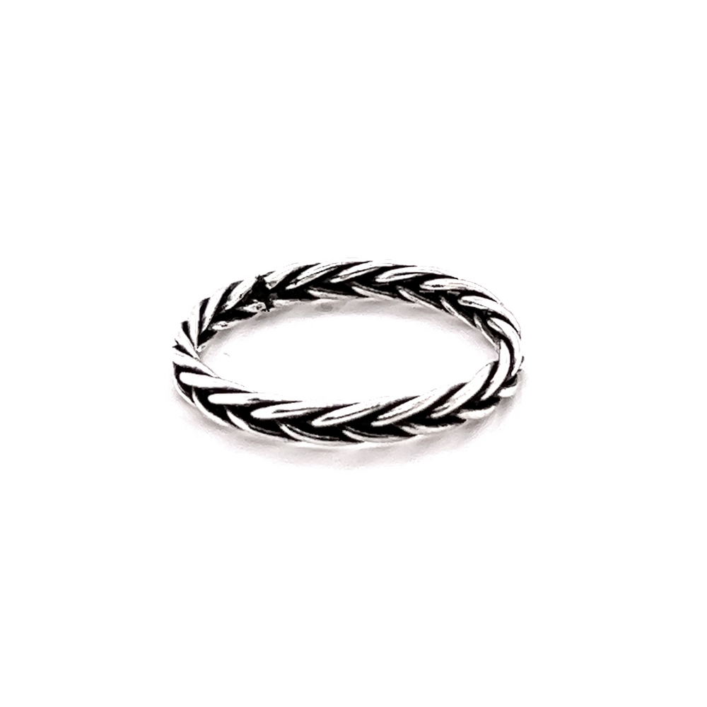 A minimalist Double Braided Band Ring on a white background with a bohemian vibe.