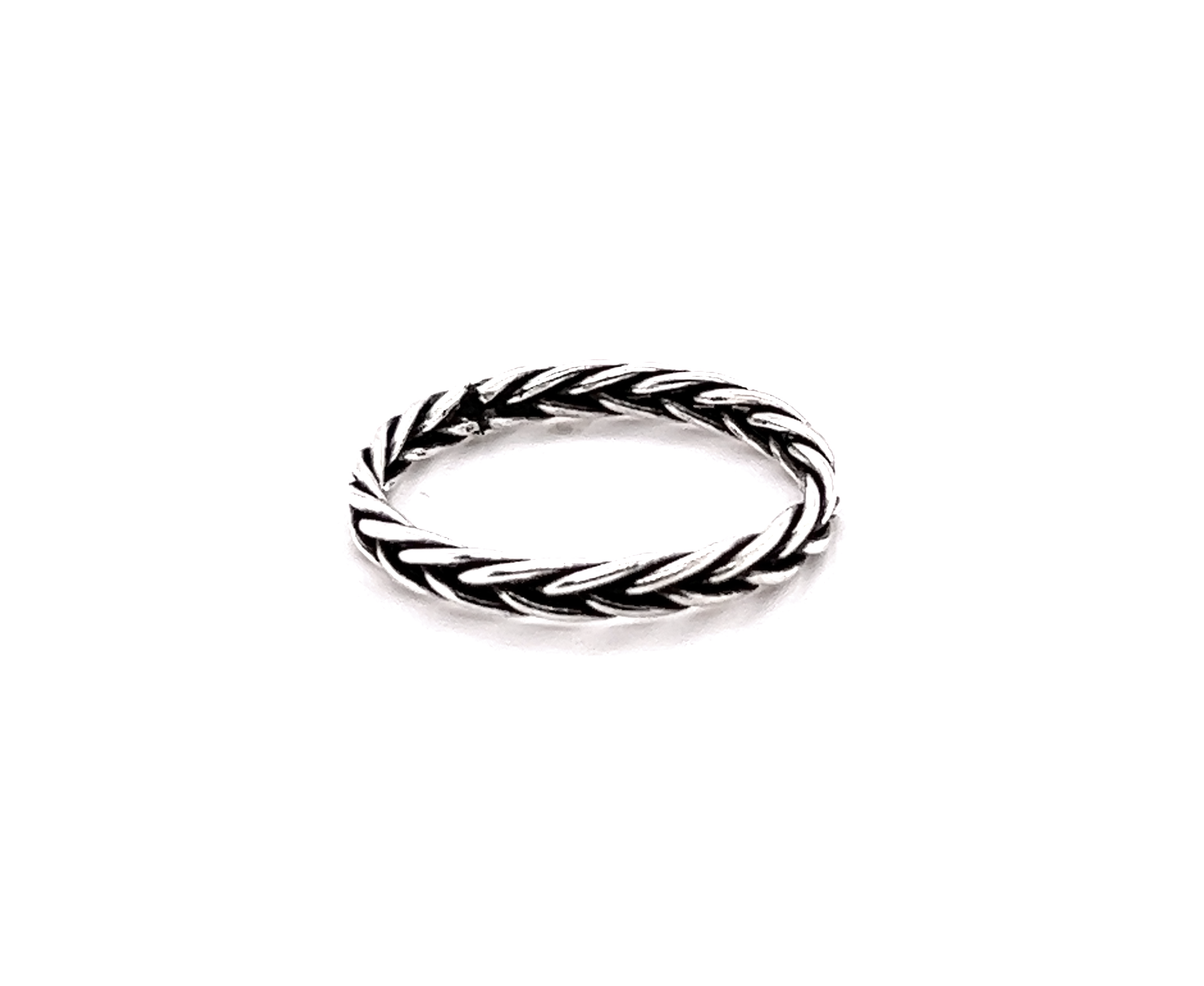 A minimalist Double Braided Band Ring on a white background with a bohemian vibe.