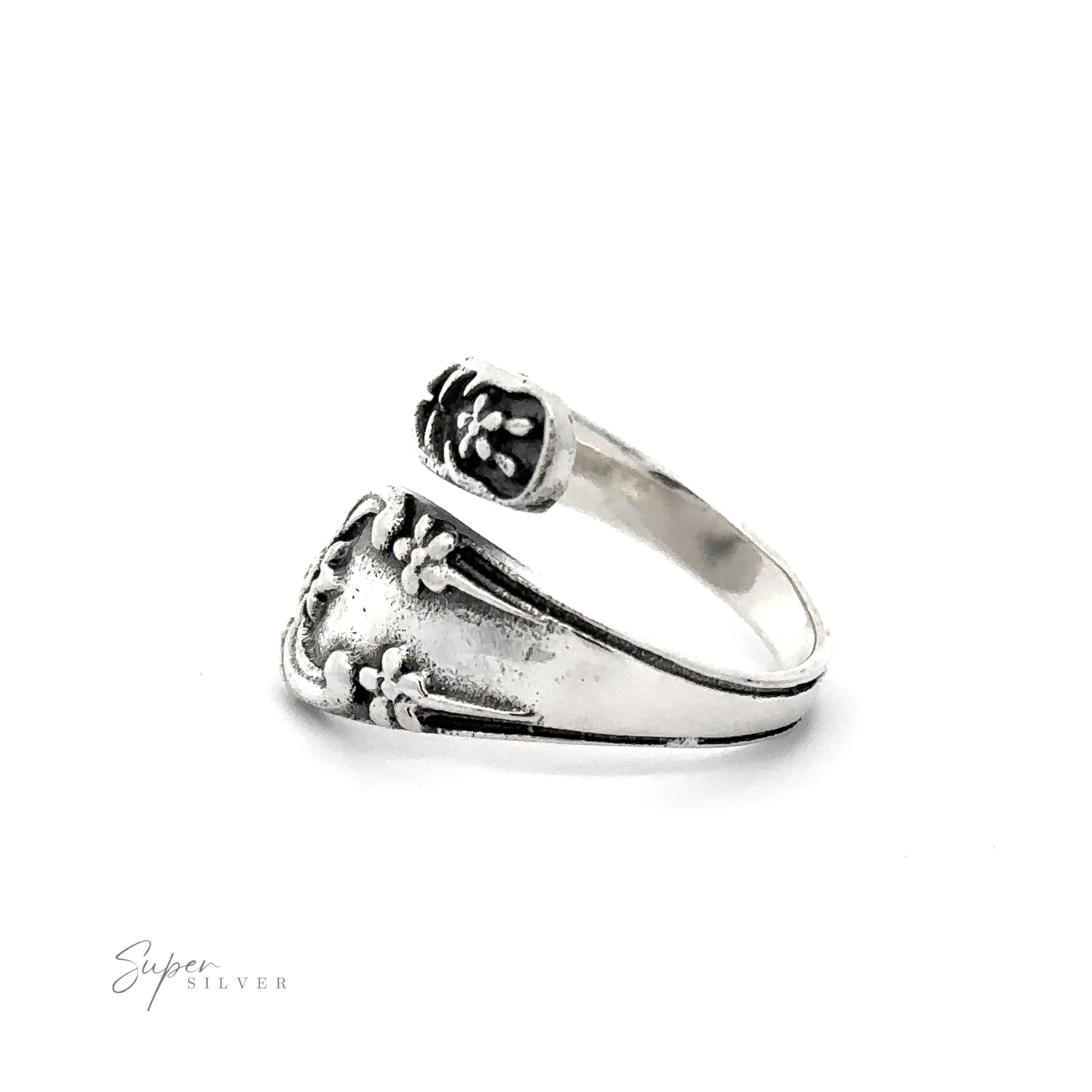 An adjustable Spoon Design Ring with a flower on it.