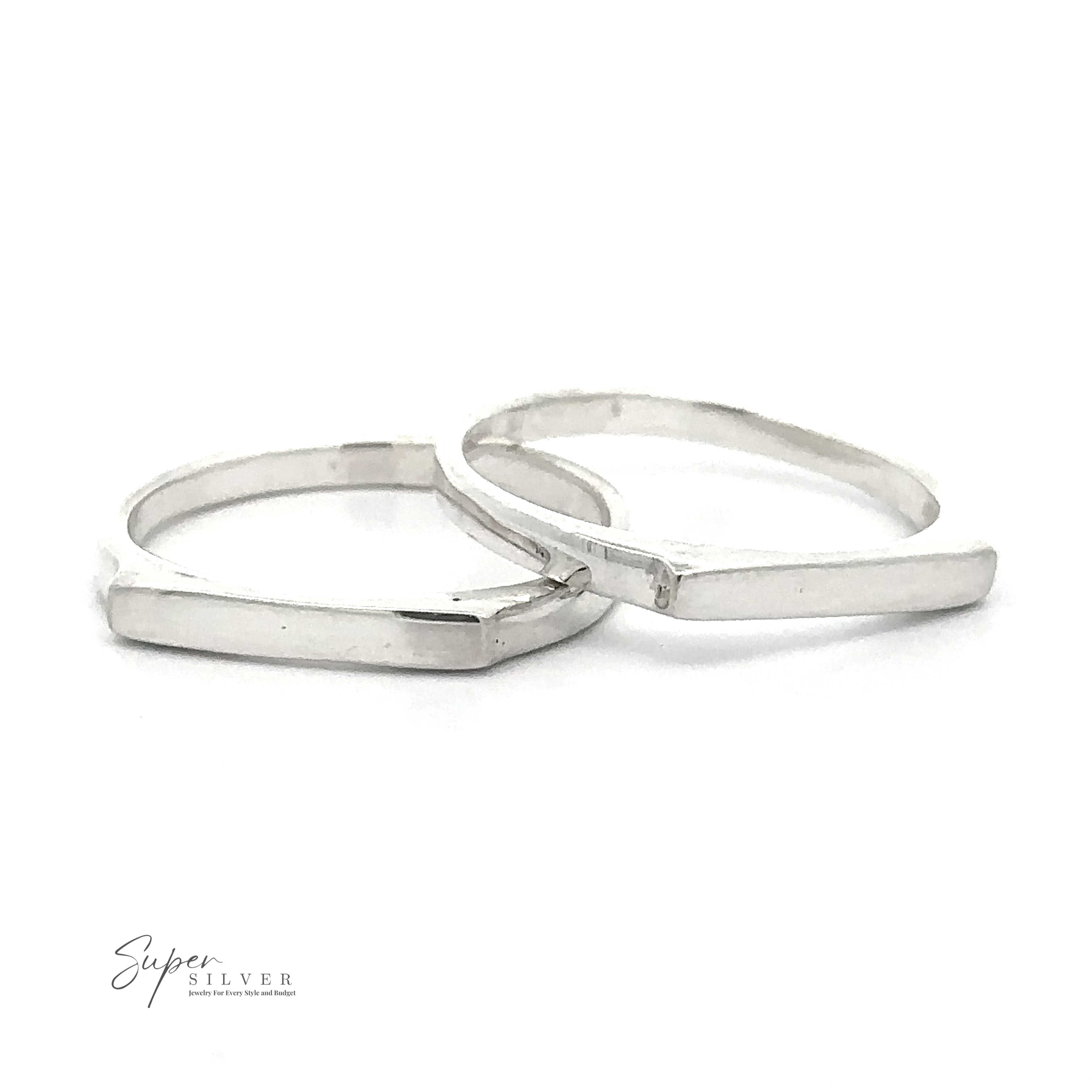 Two Dainty Silver Bar Rings with a geometric design are displayed against a white background. Embracing modern minimalism, the logo "Super Silver" is seen in the lower left corner.