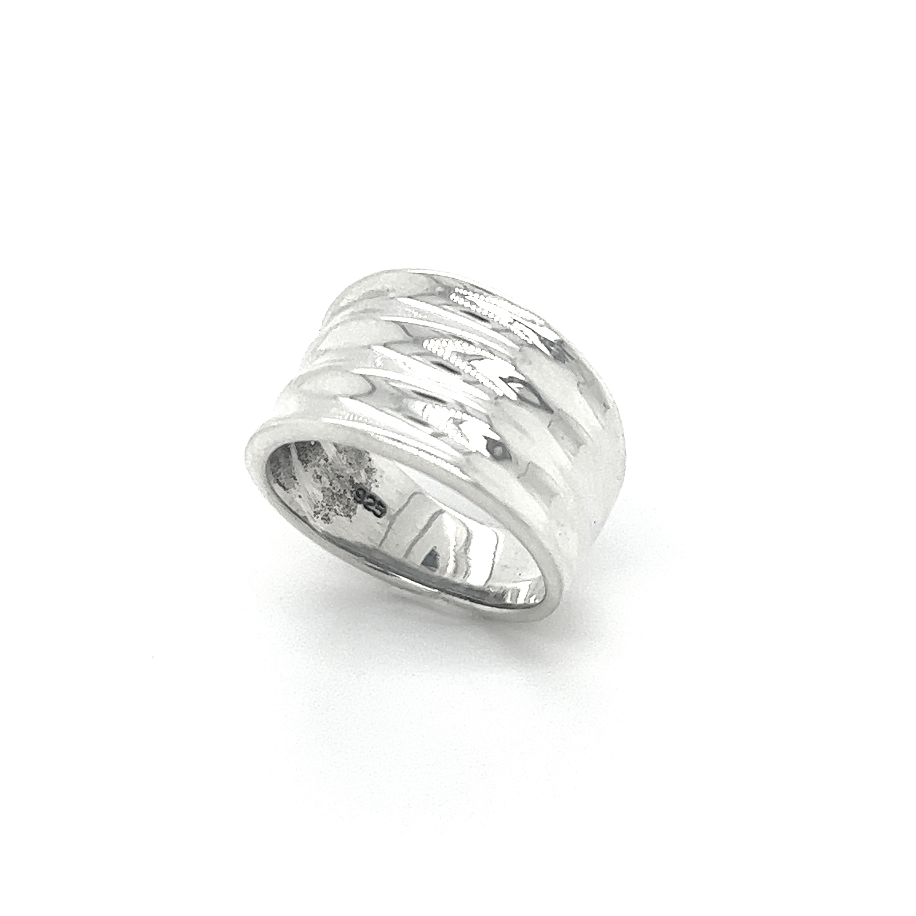A fashion-forward Super Silver Wide Tapered Band ring with a hammered pattern.