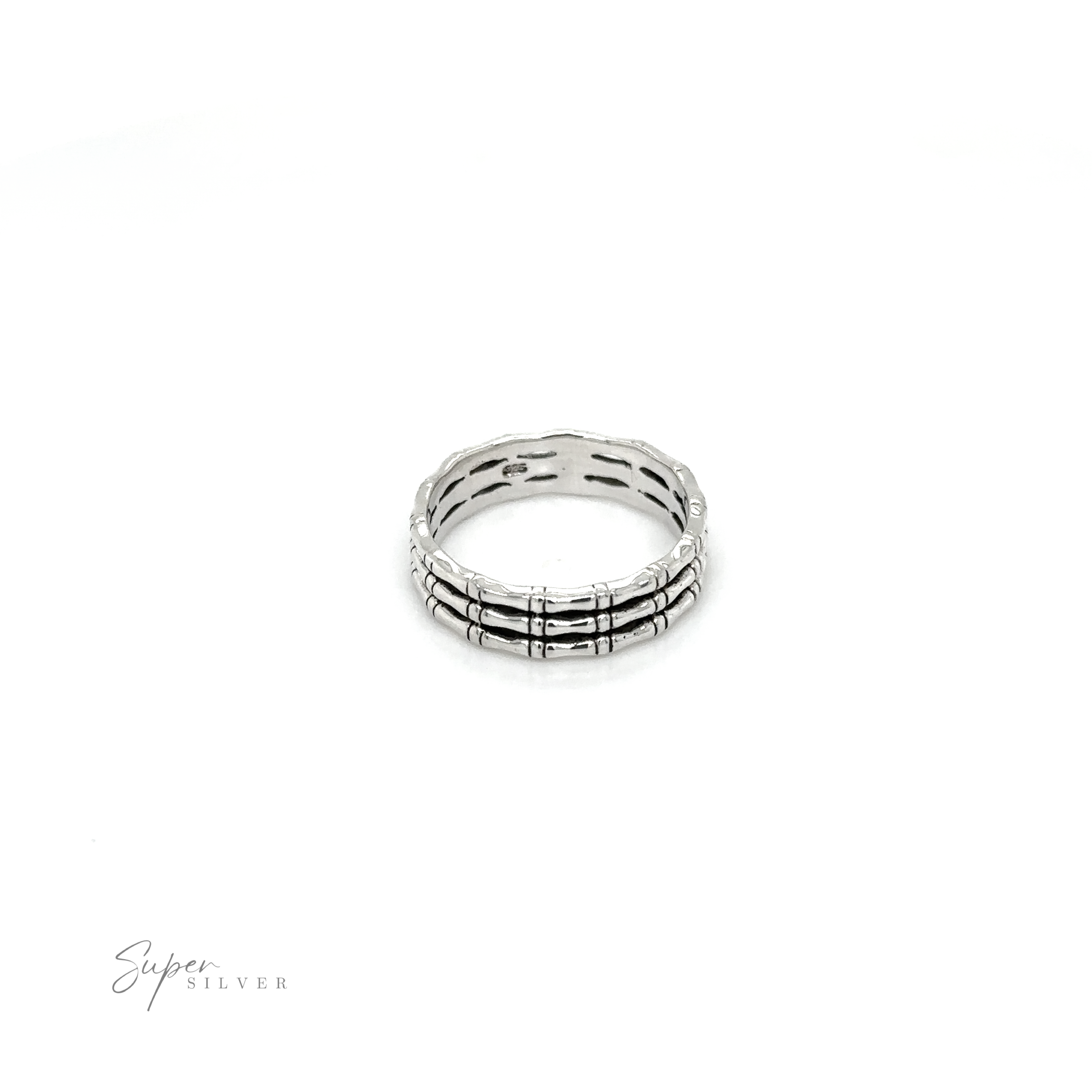 A Triple Bamboo Band ring with black and white stripes on a white background, from Super Silver, in a minimalist style.