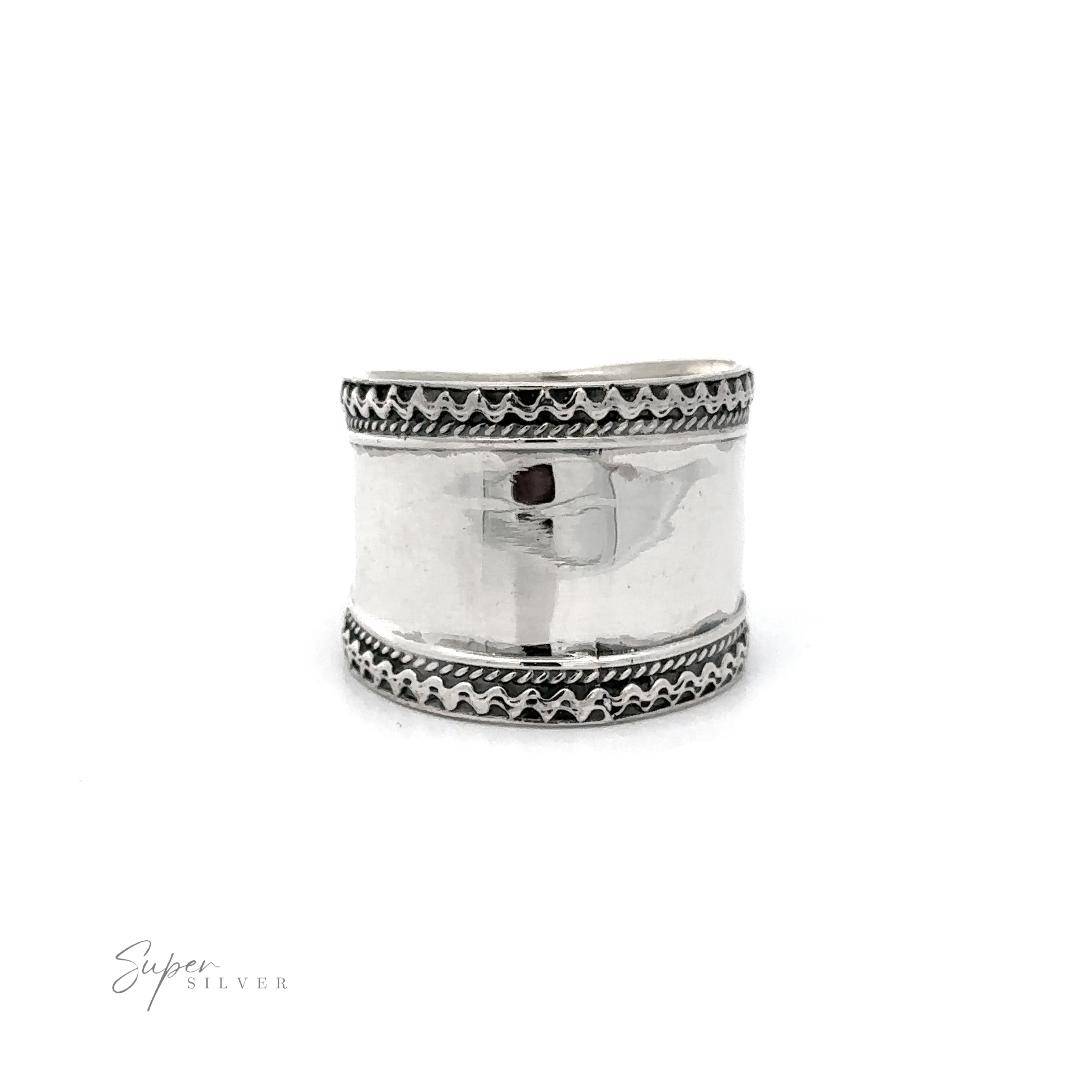 A Wide Silver Band with Etched Border with a rope pattern on it.