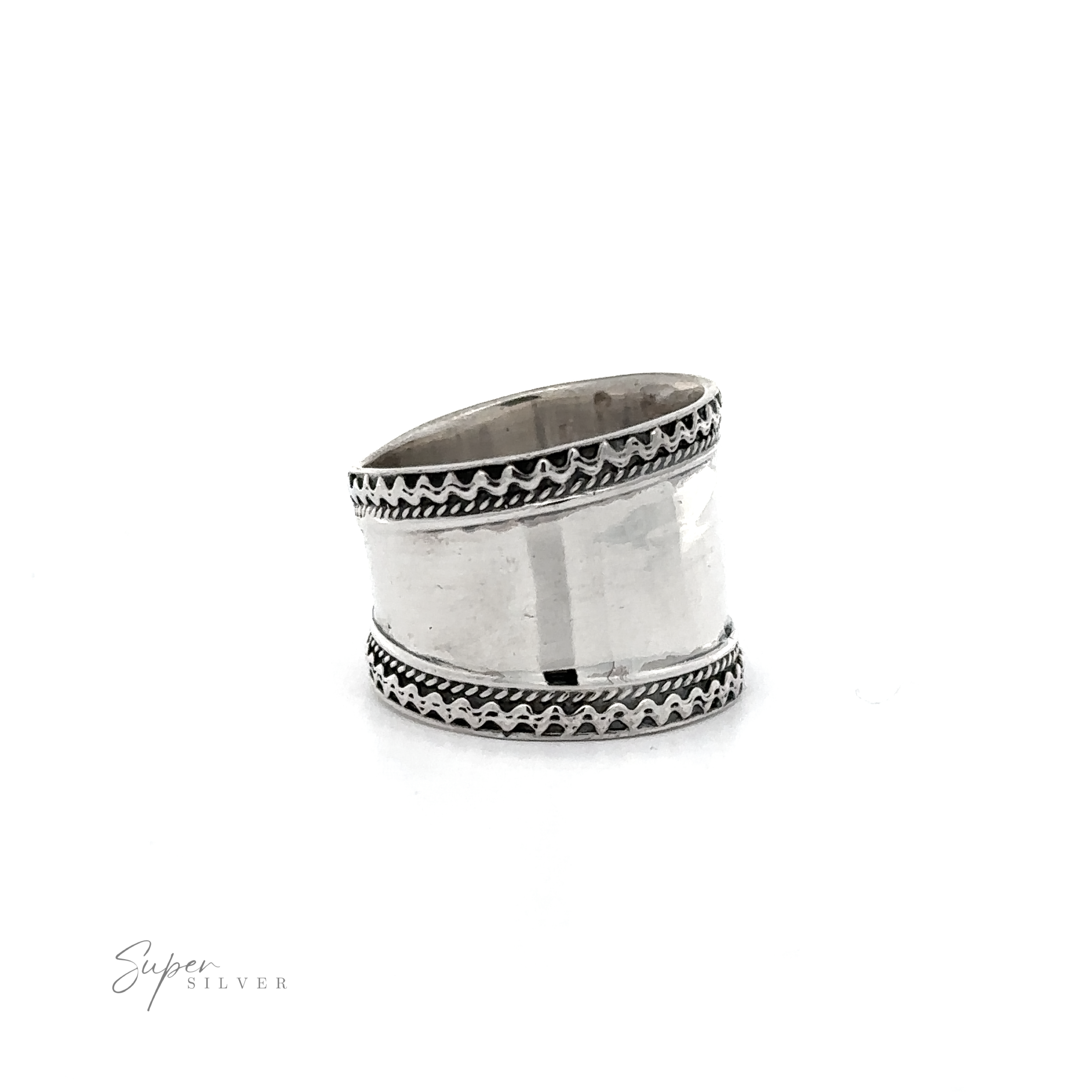 A Wide Silver Band with Etched Border ring with black and white rope pattern designs.